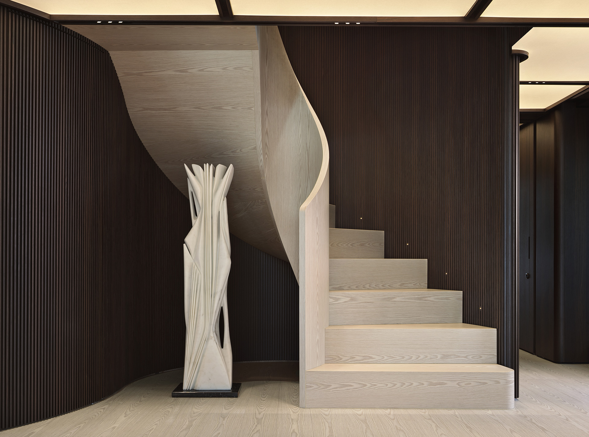 Sculptural central staircase inside the Sanlorenzo 50Steel