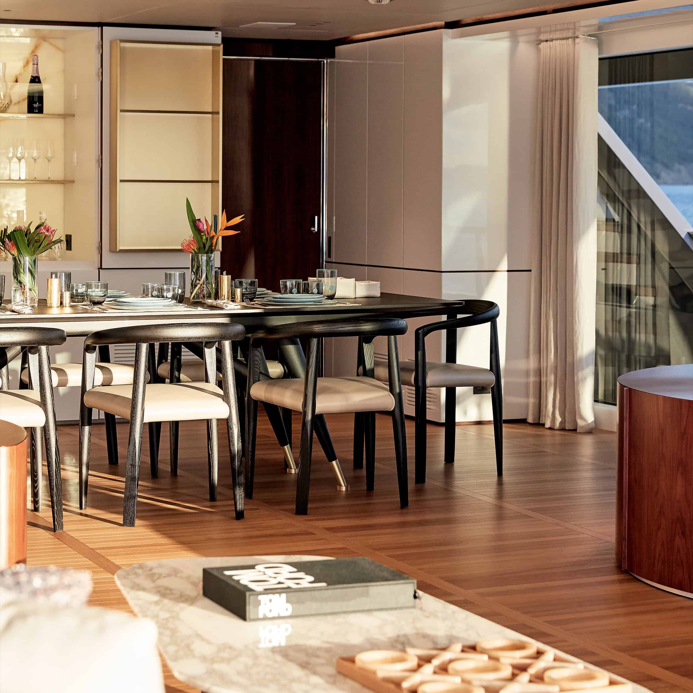 Dining area and glazed threshold aboard a Benetti Oasis 40M