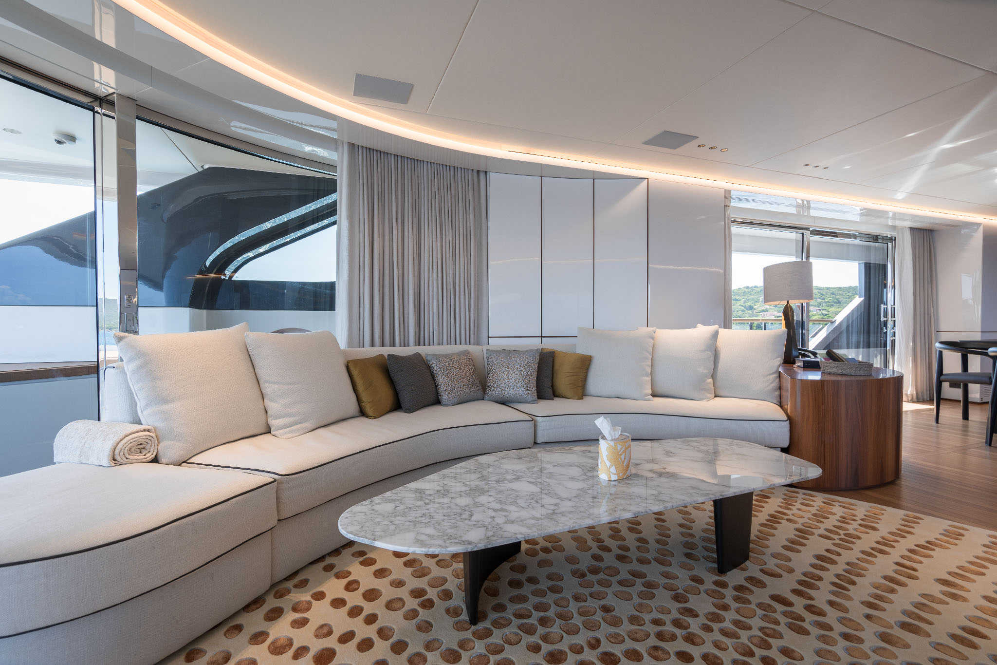 Curved lounge seating in the main salon of Benetti Oasis 40M Oreos
