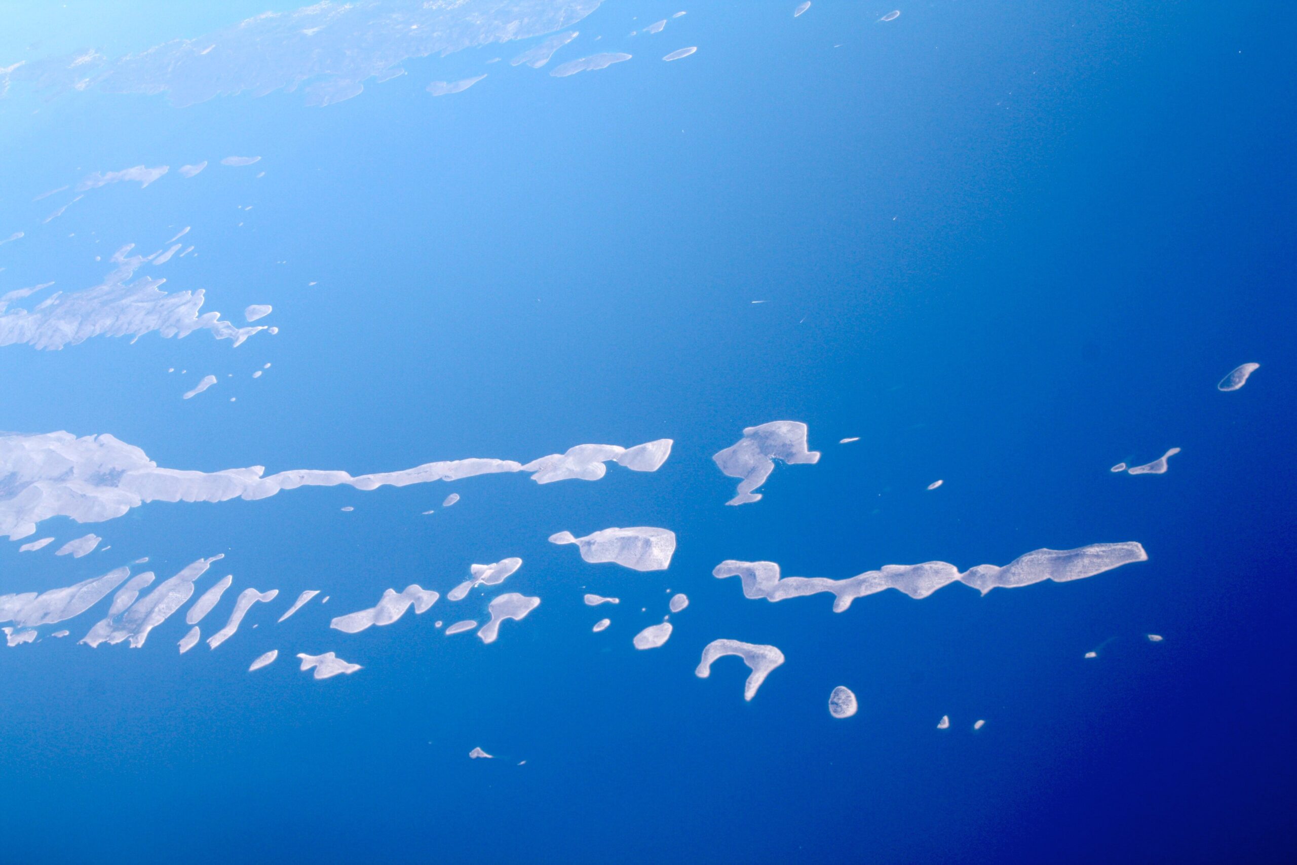 Aerial view across the pale islands and blue channels of the Kornati archipelago