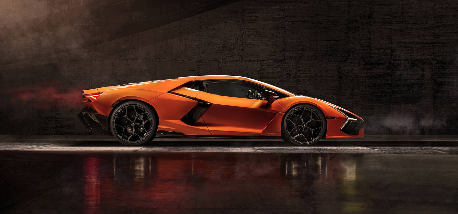Orange Lamborghini Revuelto in a full side profile