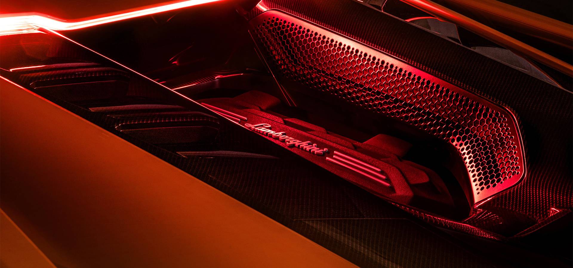 Illuminated Lamborghini V12 engine detail beneath the Revuelto rear bodywork