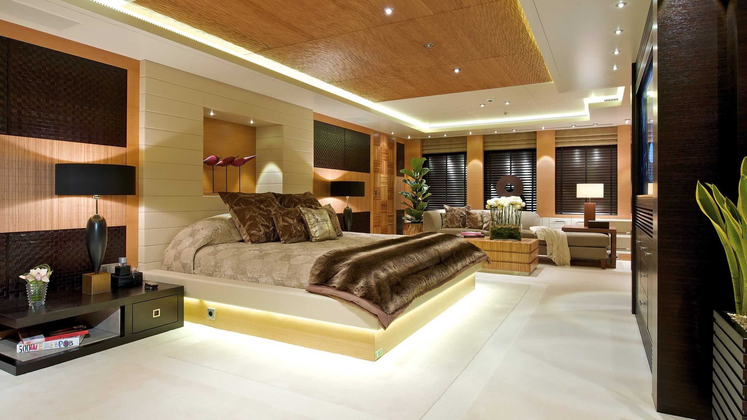 Warmly finished owner suite inside a custom superyacht