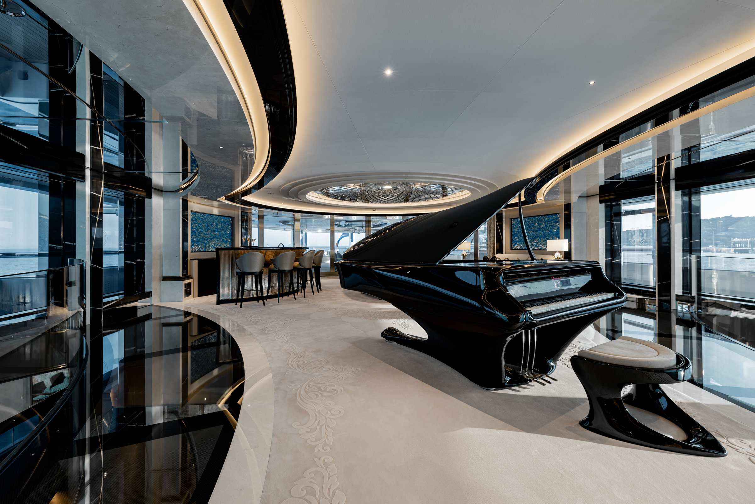 KISMET interior lounge with a black grand piano and panoramic glazing