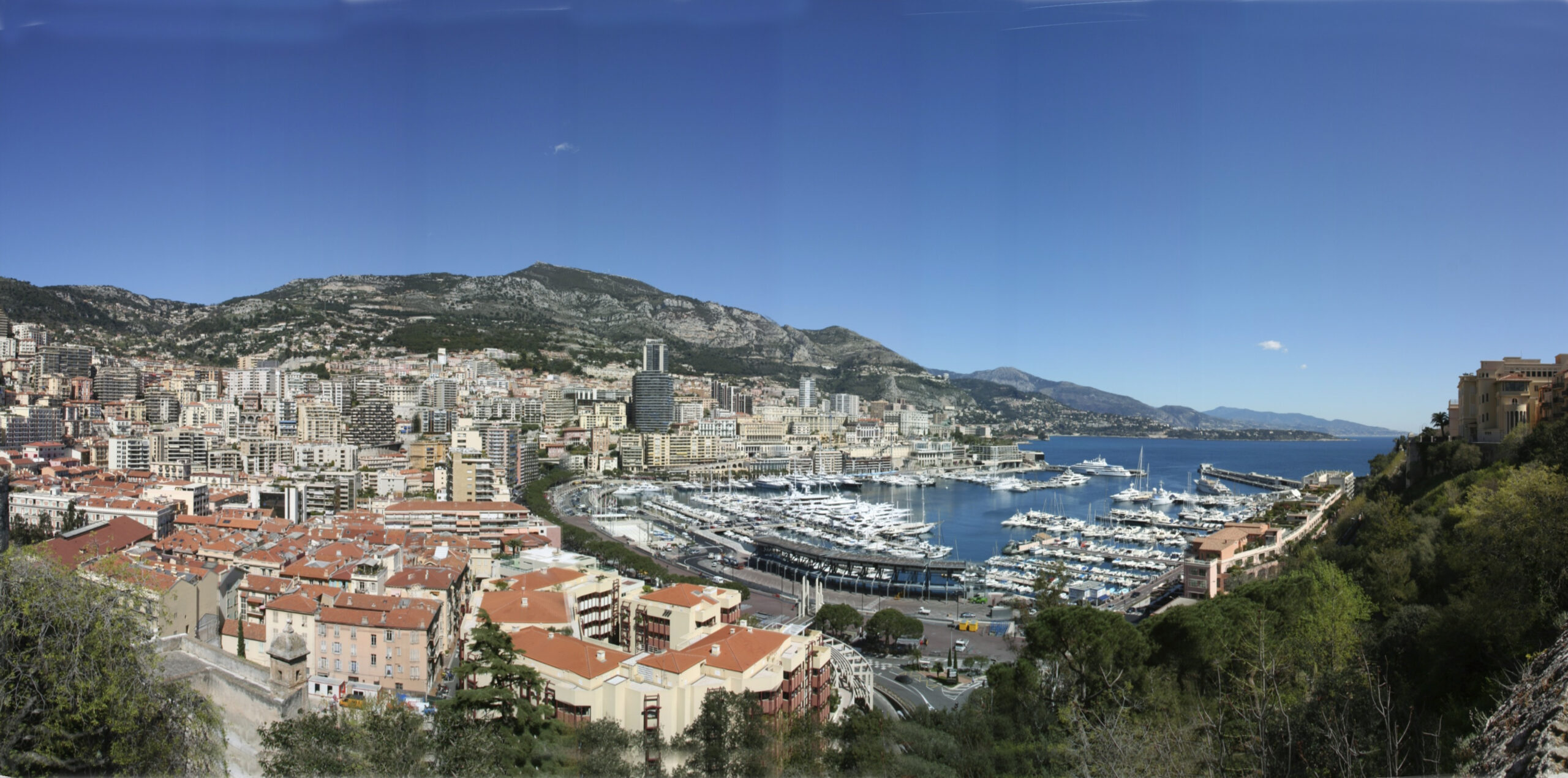 Wide panorama of Monaco and Port Hercule beside the Mediterranean