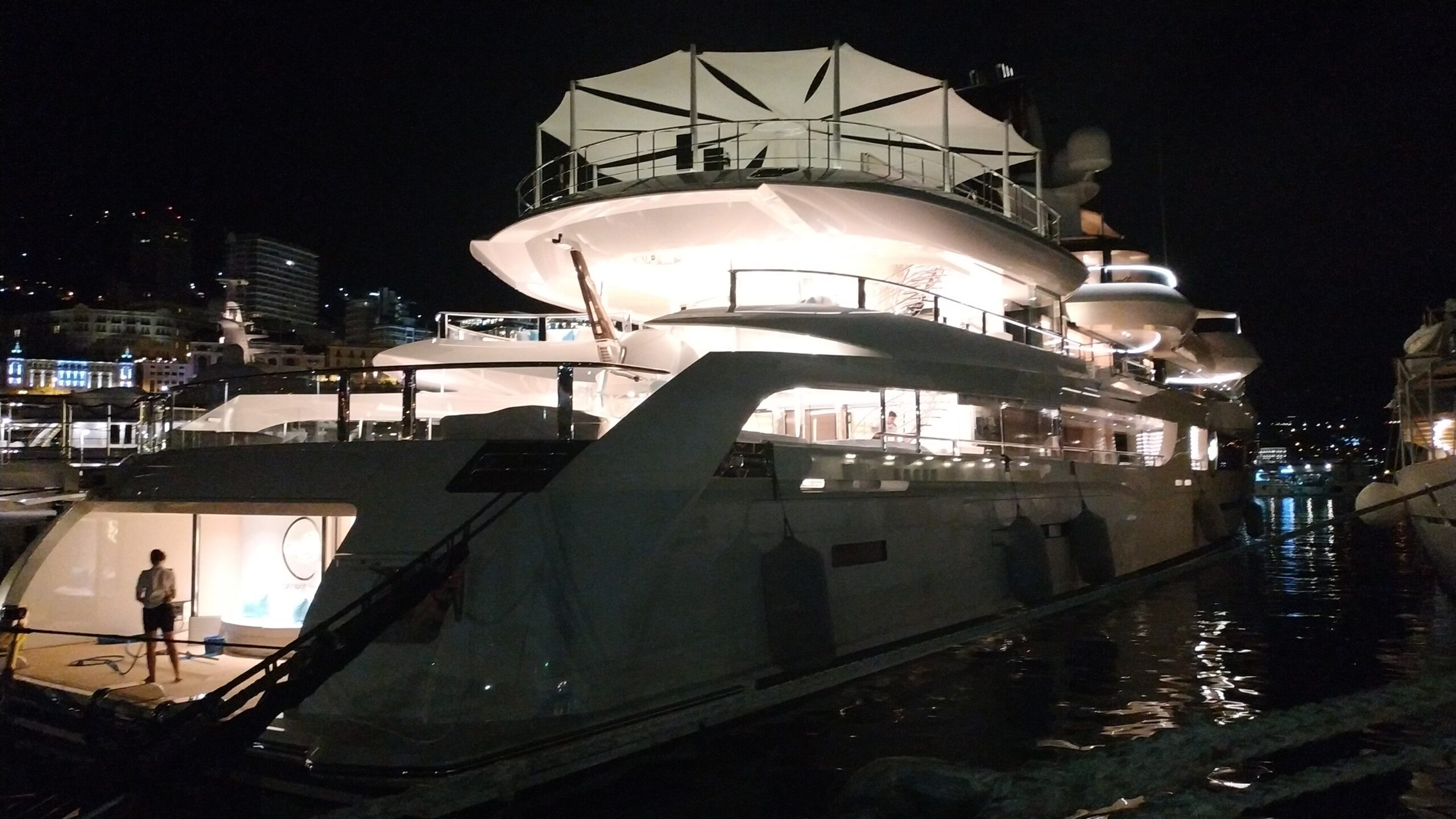 Superyachts illuminated in Port Hercule at night