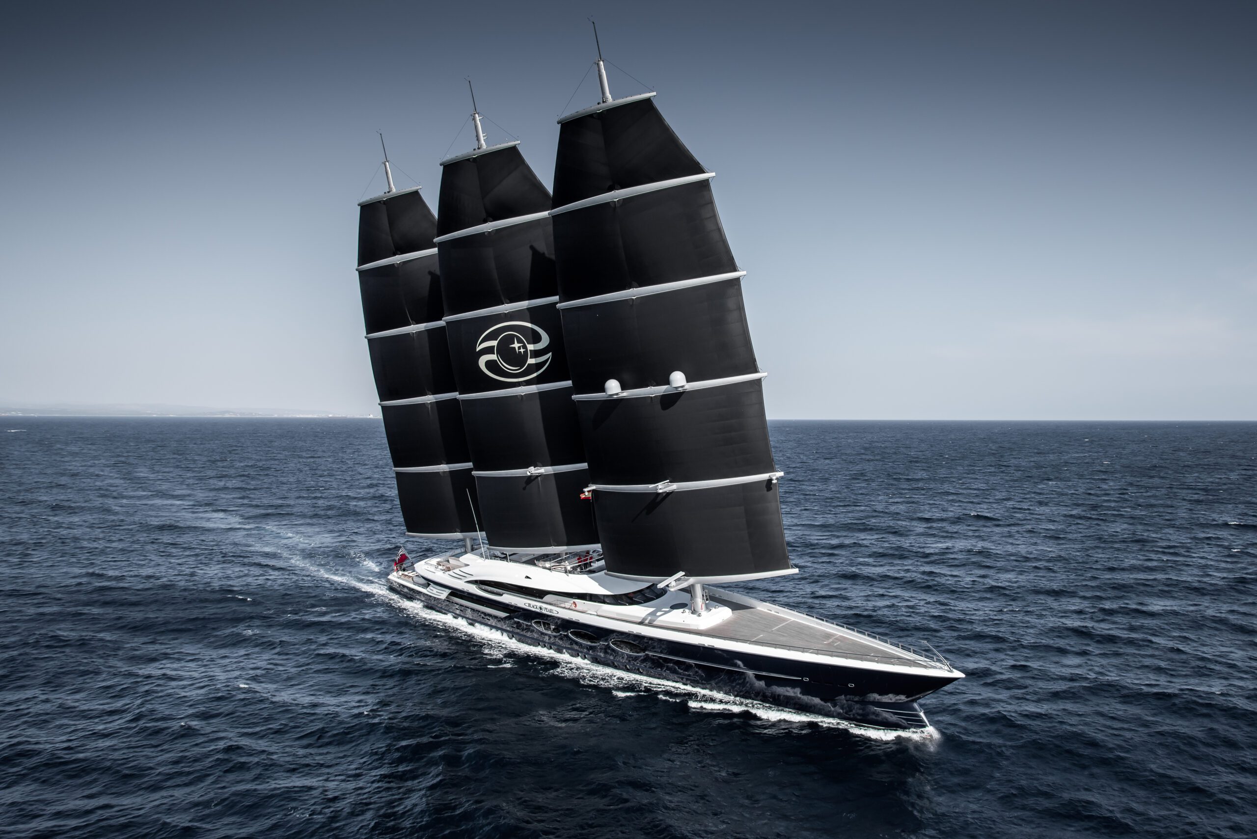 Oceanco BLACK PEARL sailing at sea under its three black DynaRig masts
