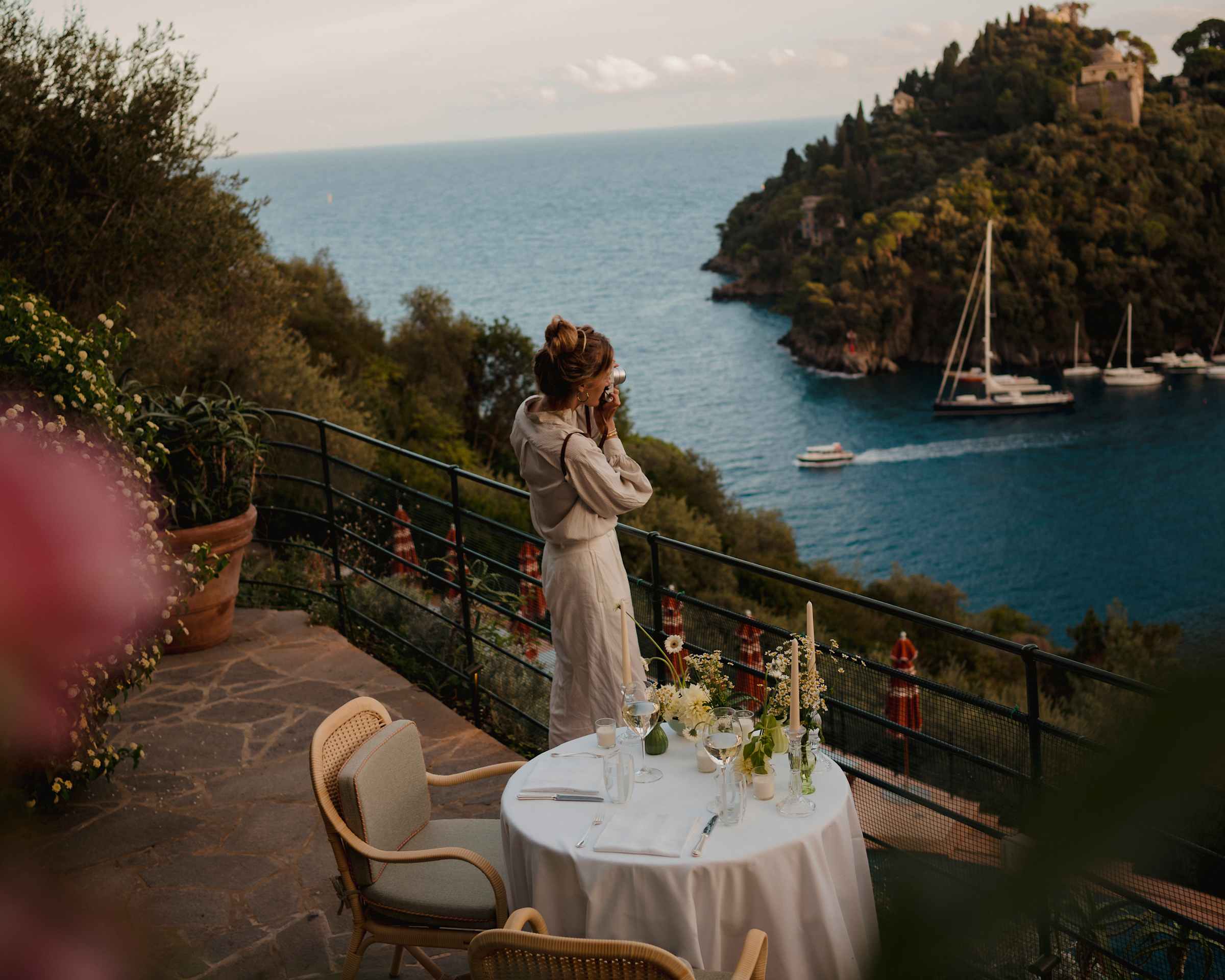 View from a hillside terrace across Baia Cannone near Portofino with boats on the Ligurian Sea