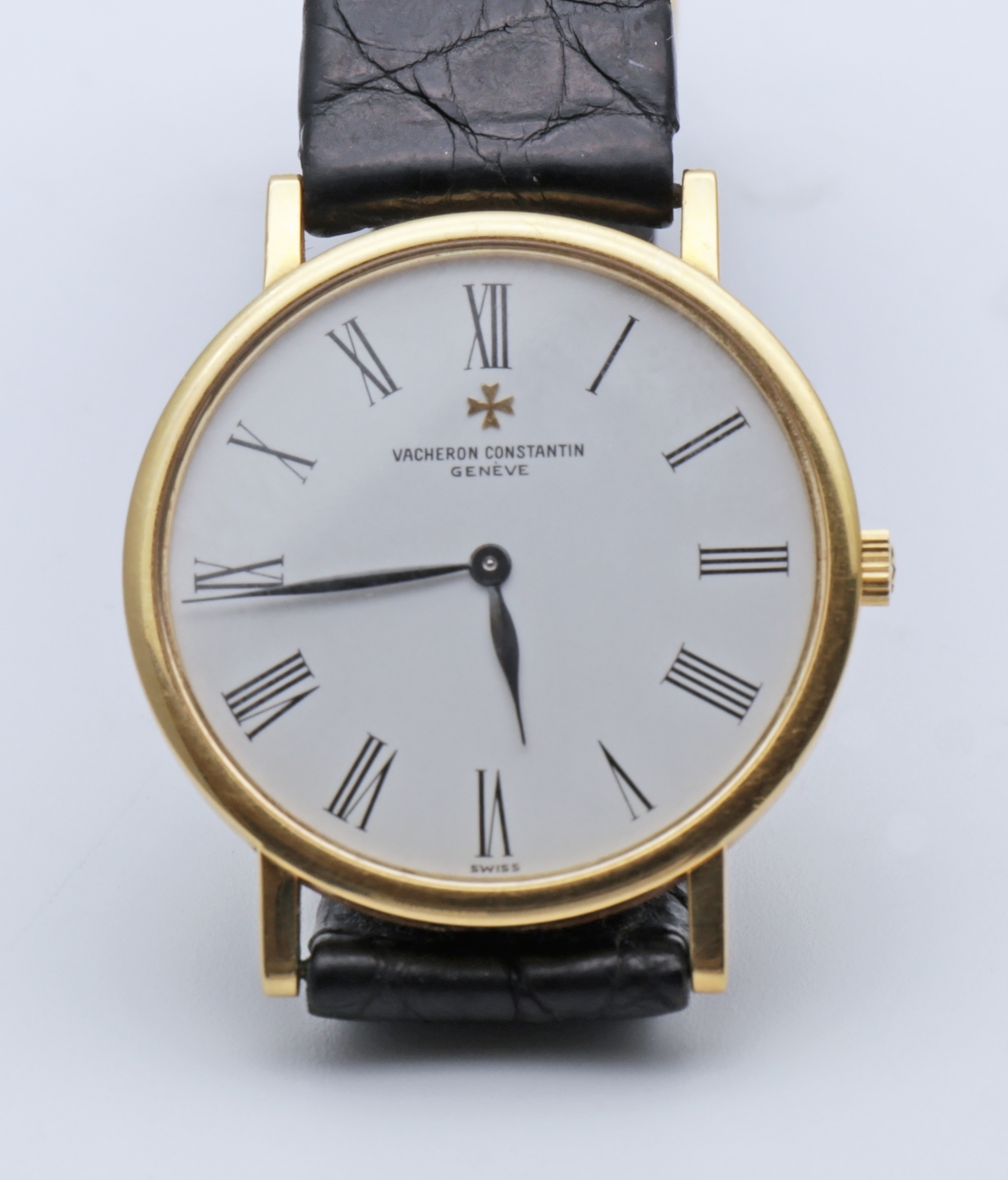 Gold Vacheron Constantin Patrimony wristwatch photographed on a dark background