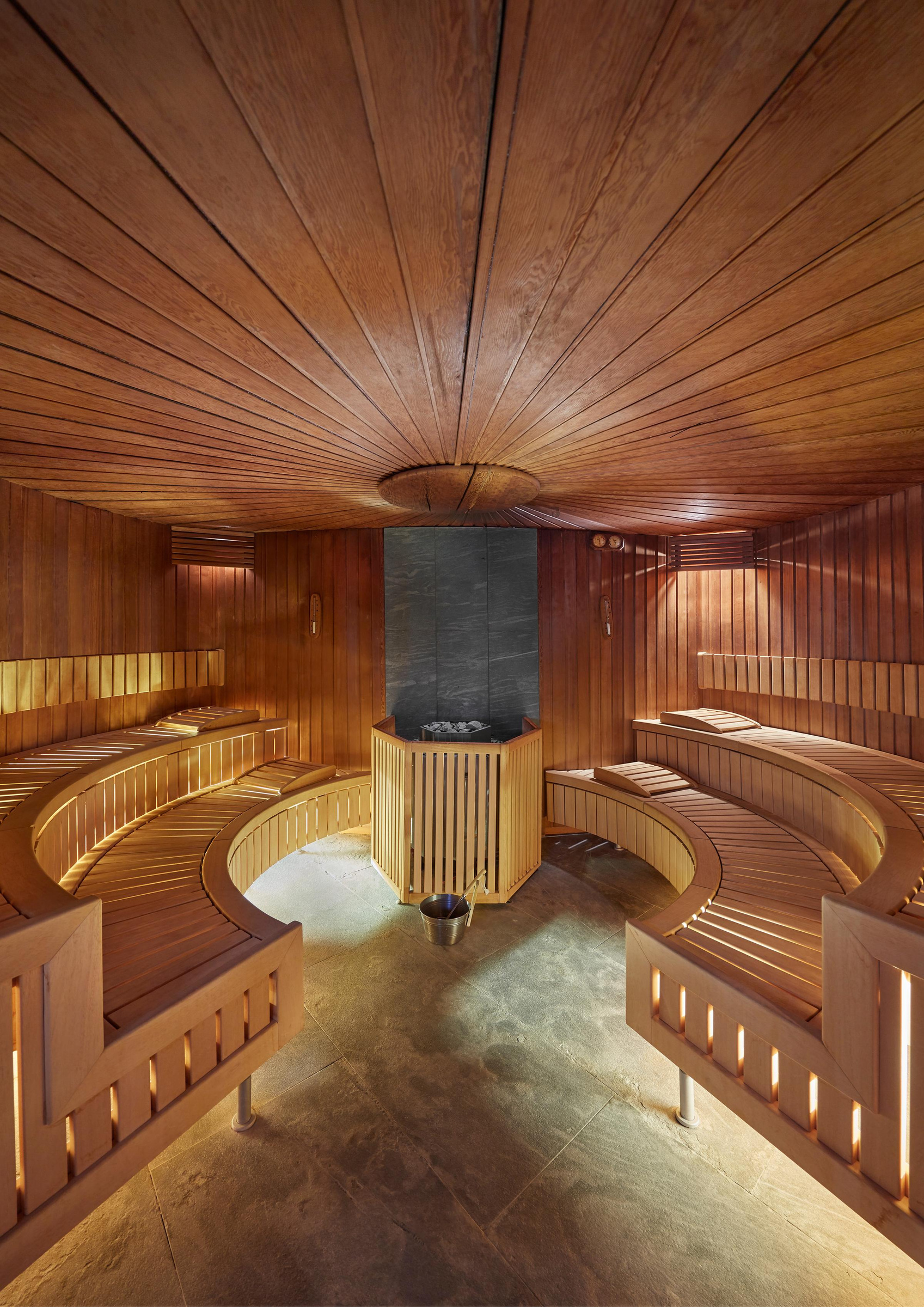 The curved timber sauna in the spa