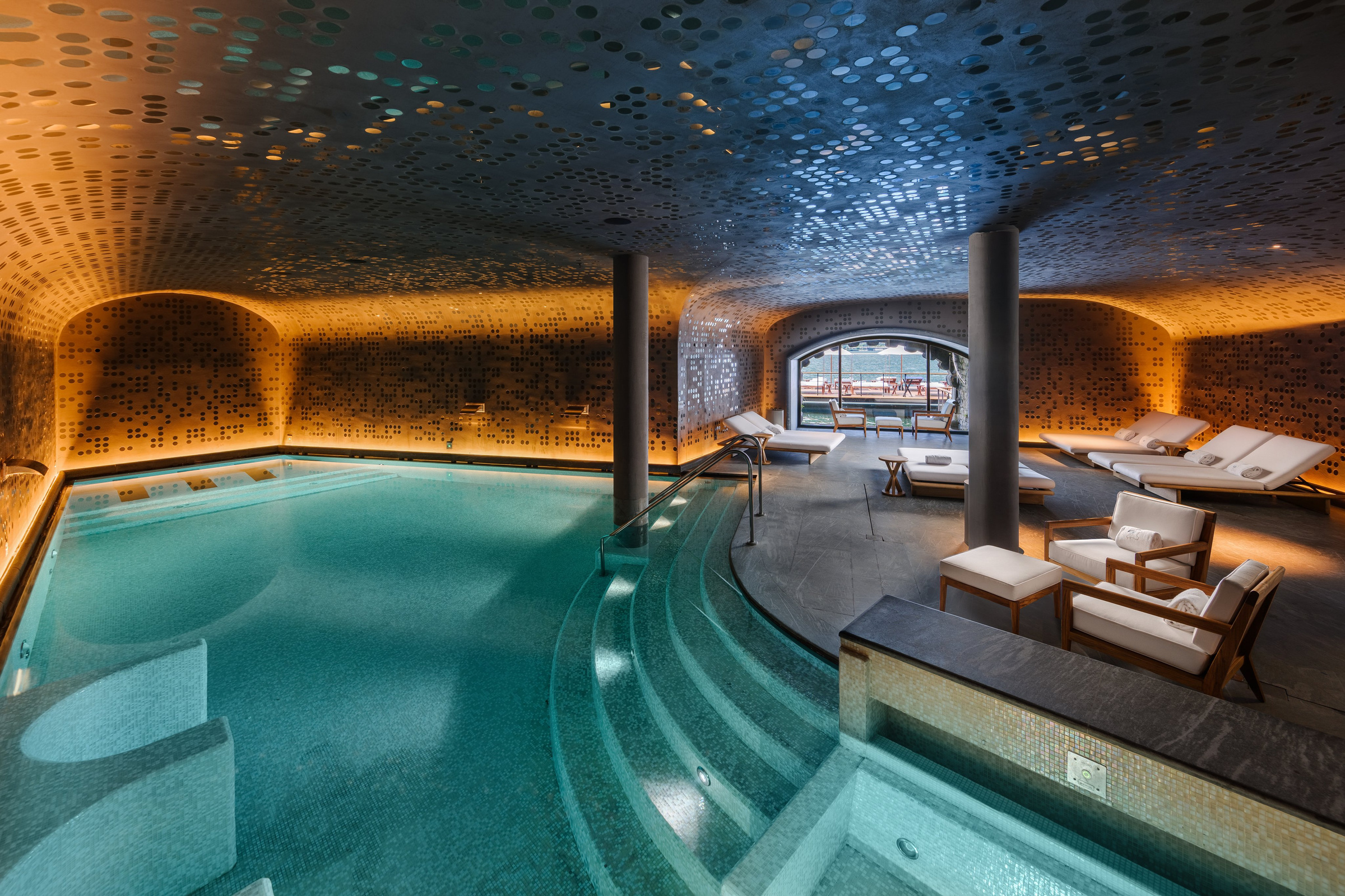 The indoor spa pool and reflective ceiling