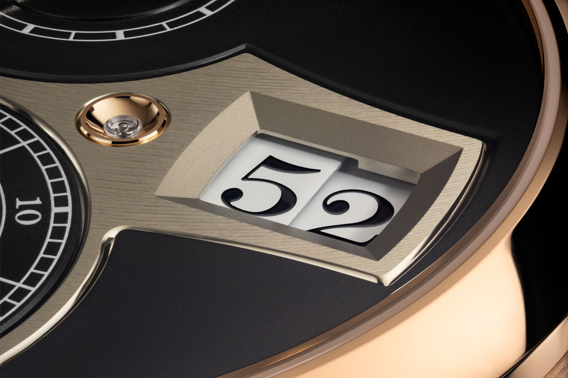 The minute digits and the edge of the time bridge