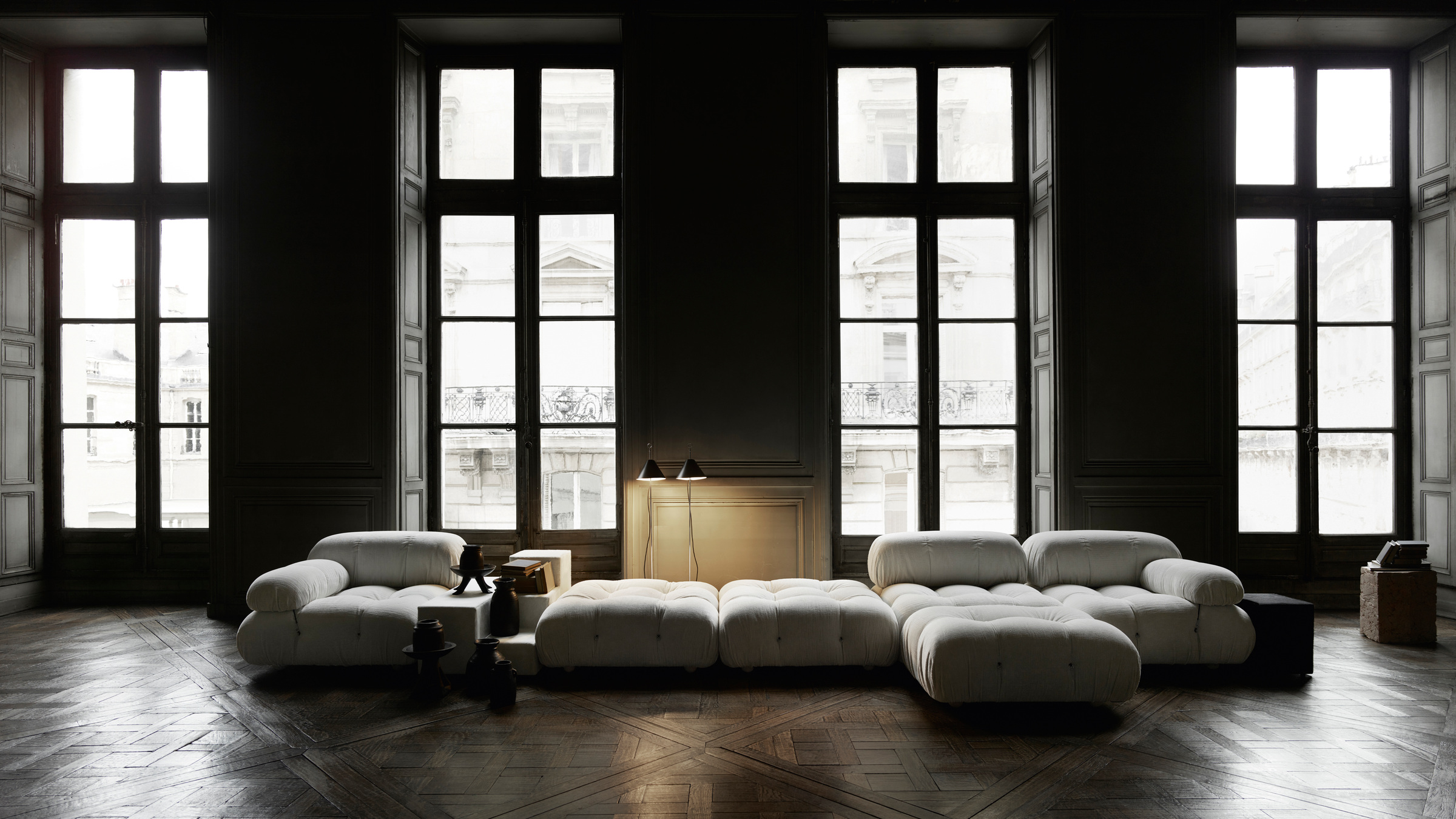Camaleonda in an official room setting with tall windows and timber flooring