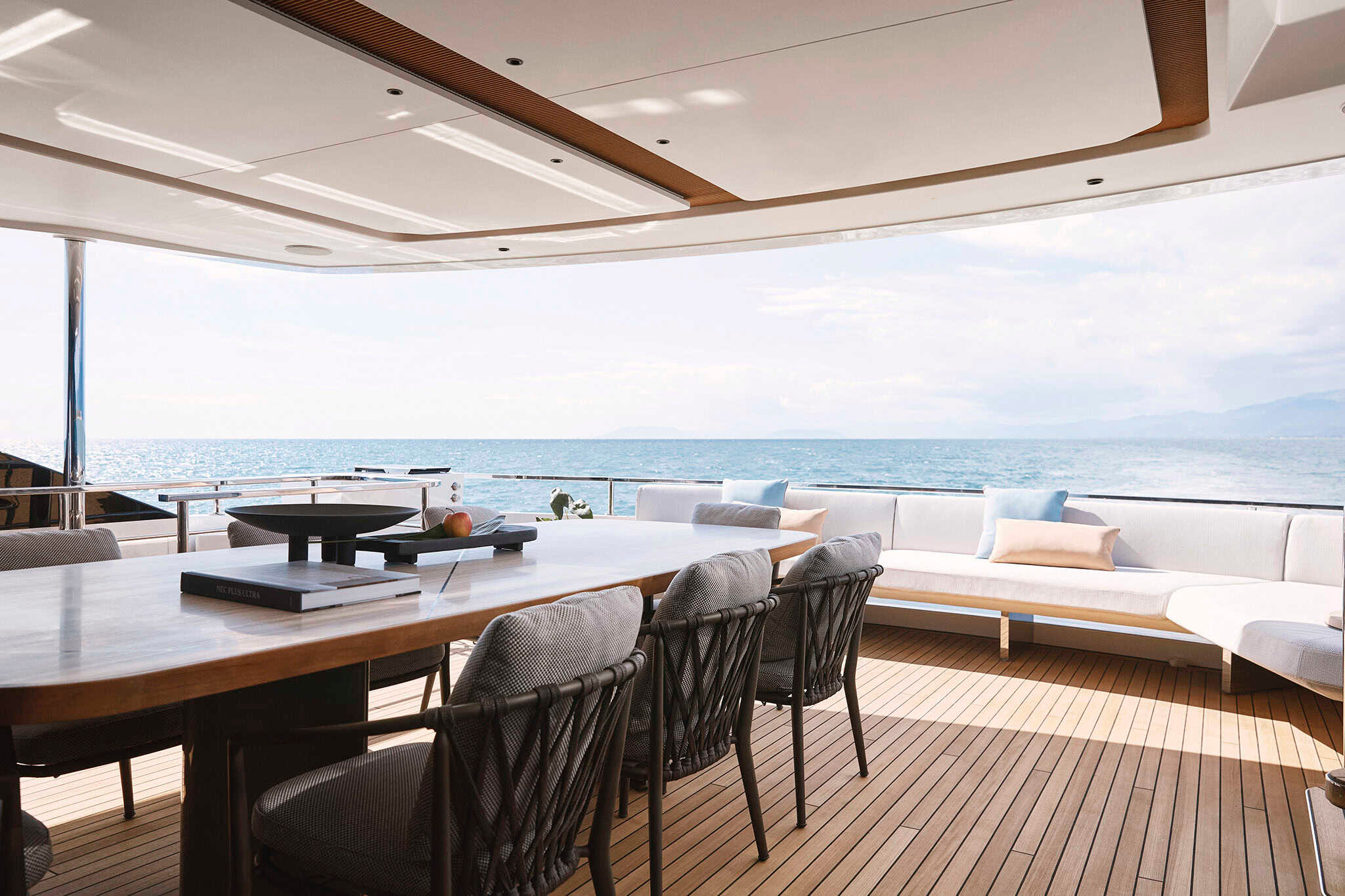 The separate upper-deck terrace and outdoor dining setting