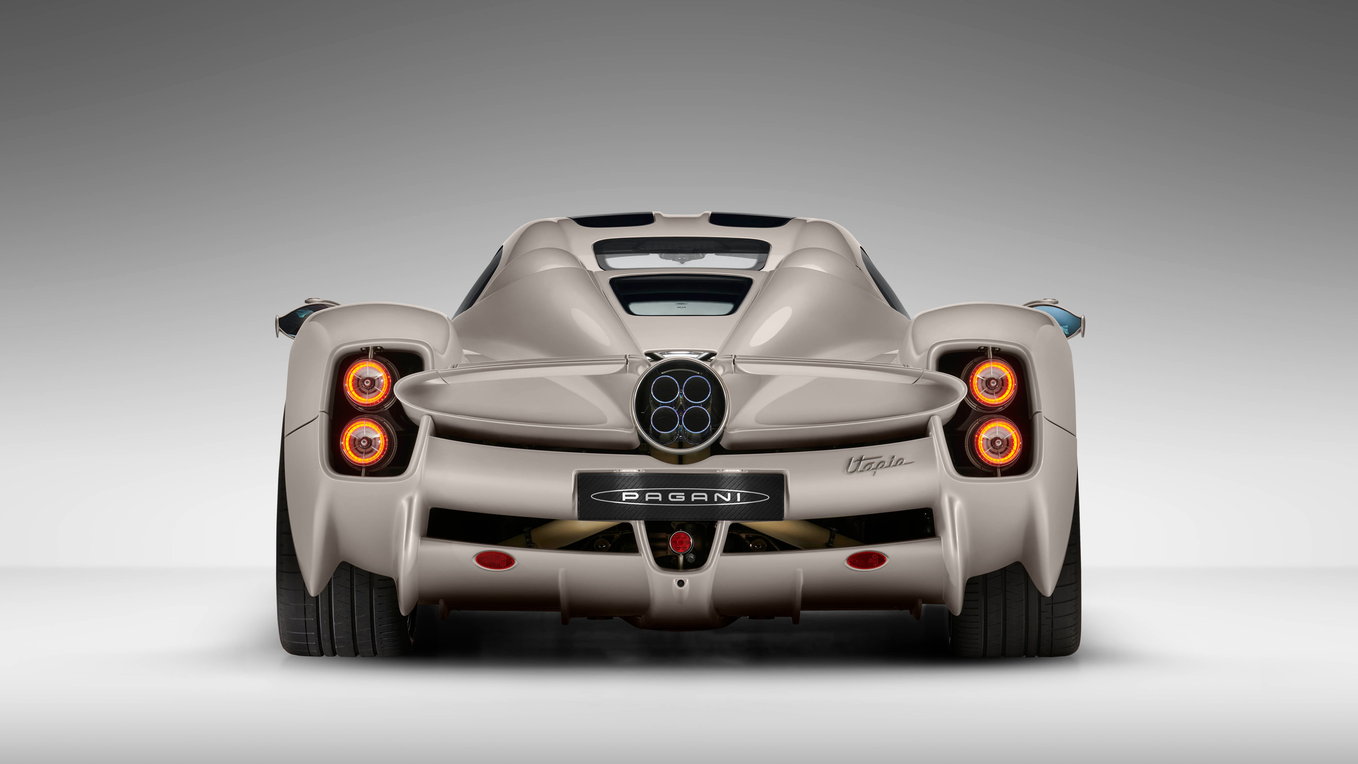 Rear studio visual showing lights and the central exhaust arrangement