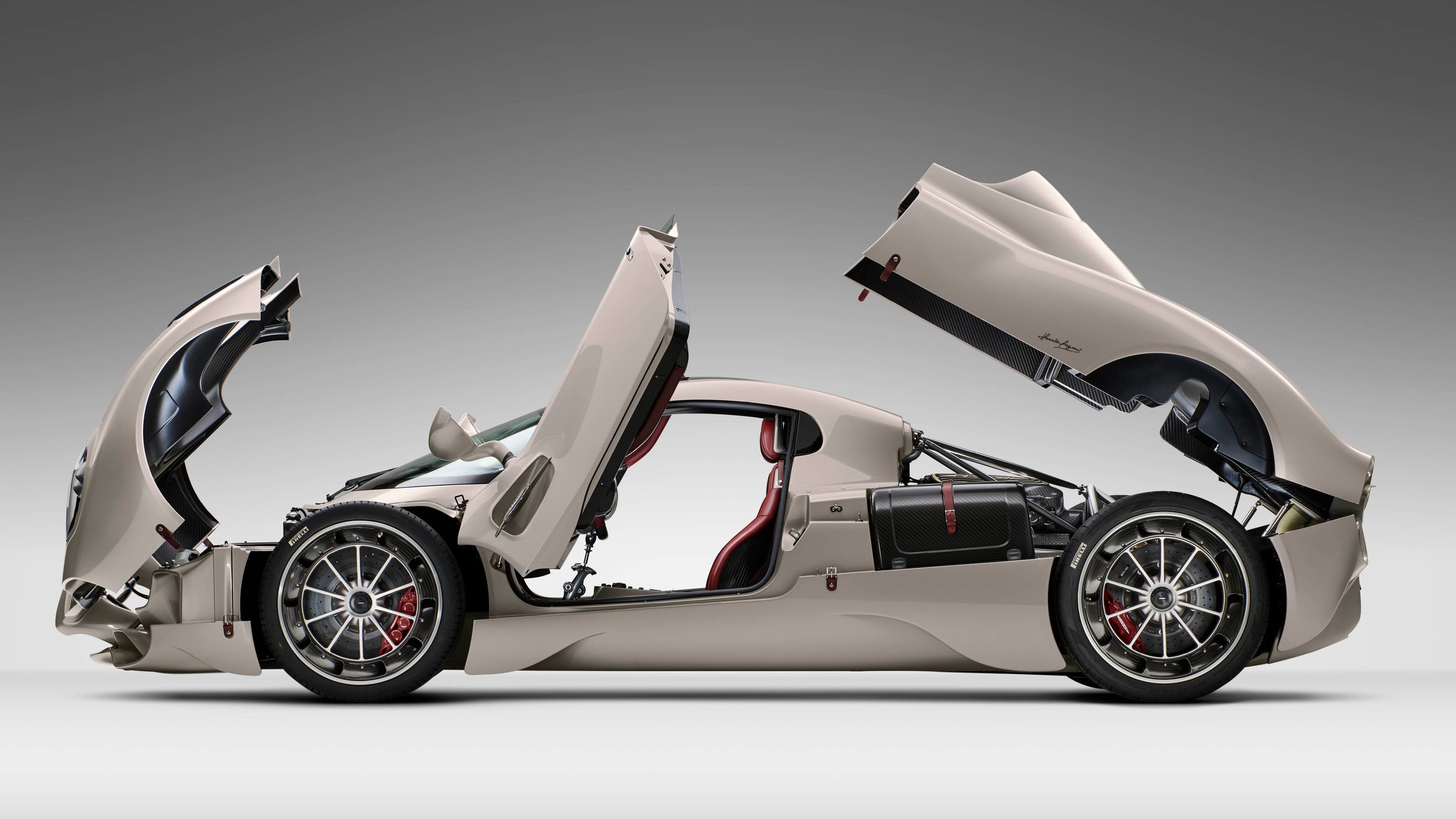The original coupé with body sections and doors opened in the studio
