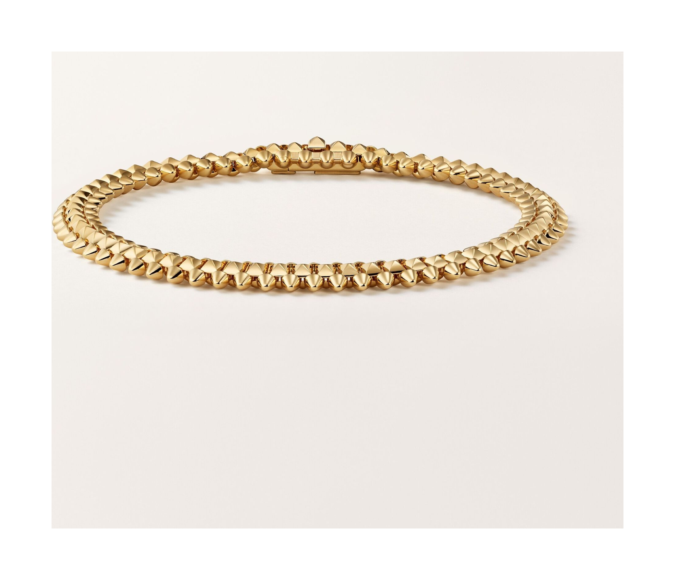 Flexible Clash de Cartier bracelet in a yellow-gold-coloured official studio view