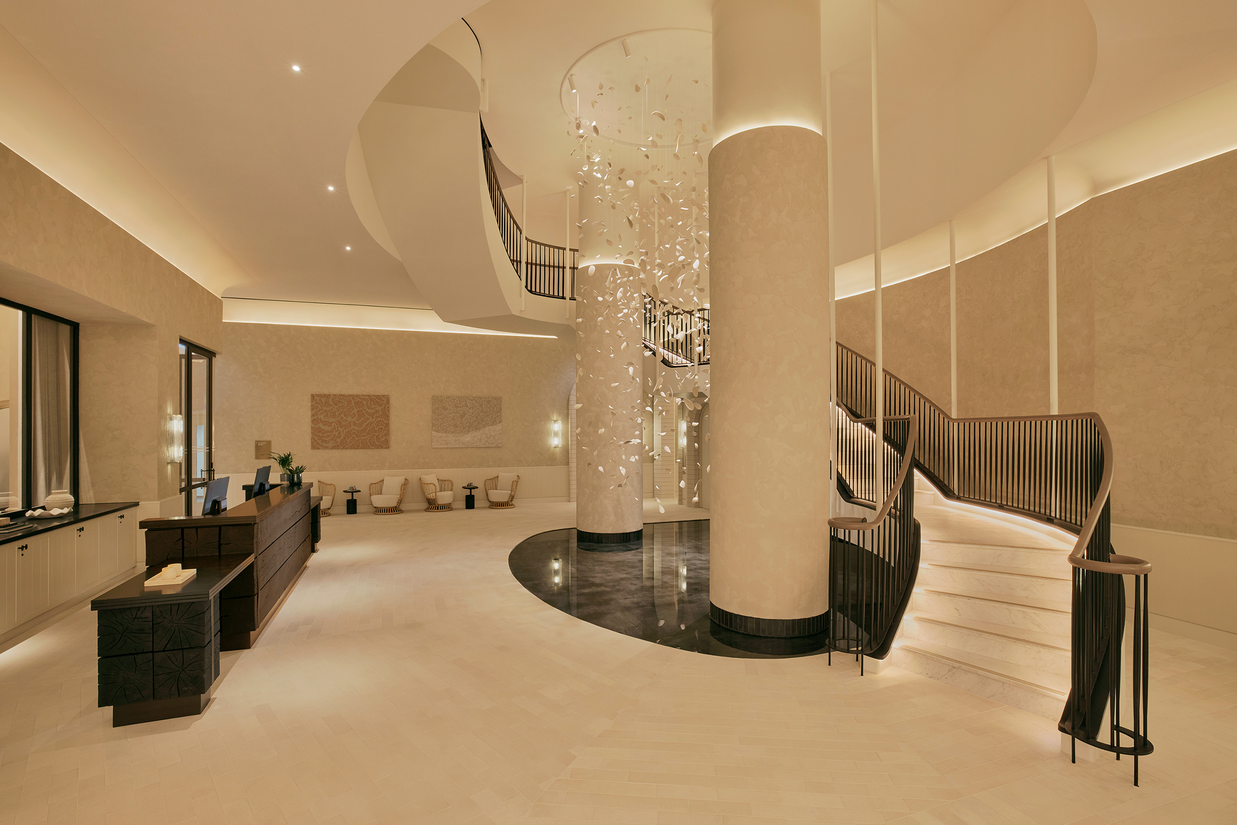 Lobby with a broad central column and curved ceiling treatment