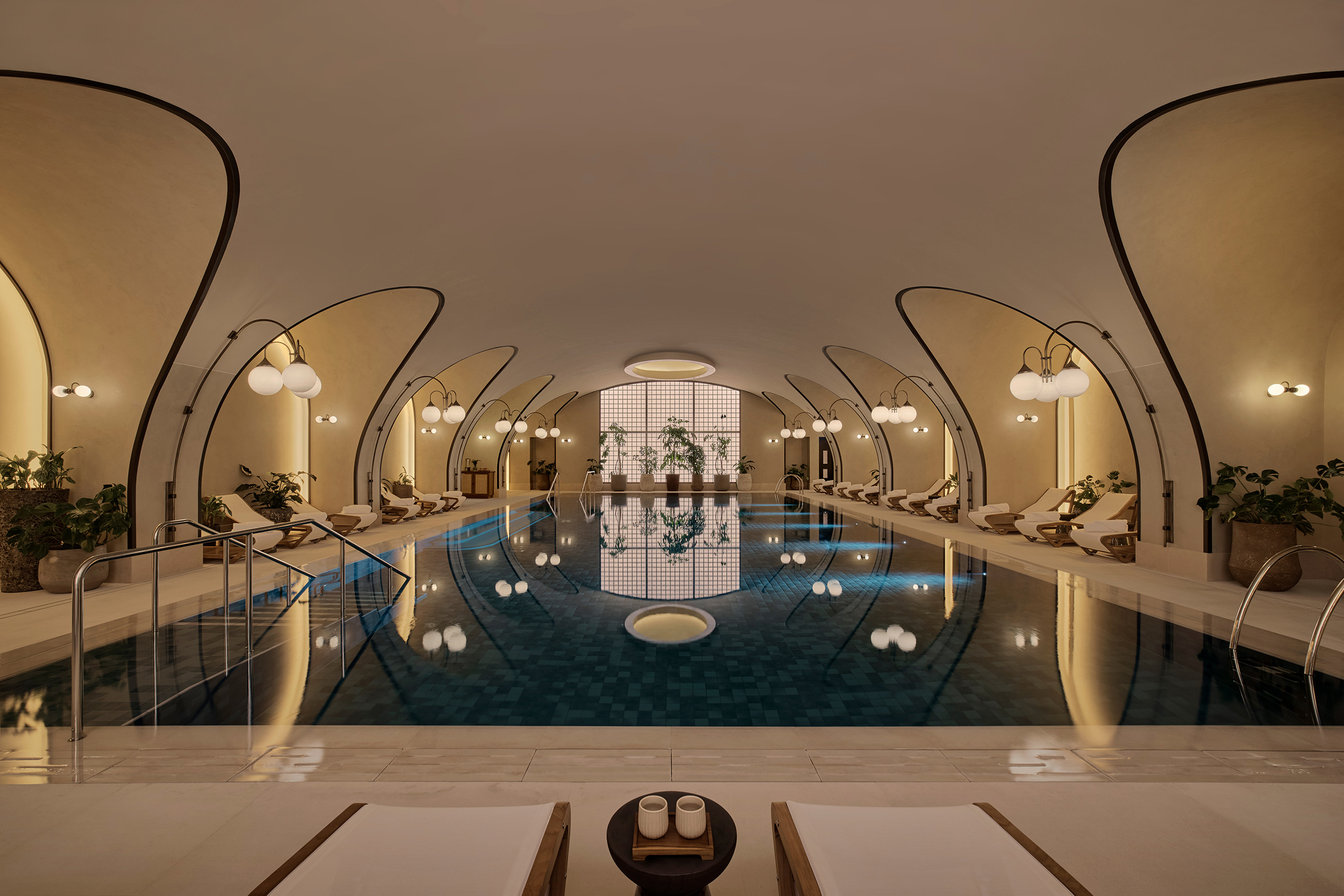 The pool beneath a sequence of arches, official Six Senses London photograph