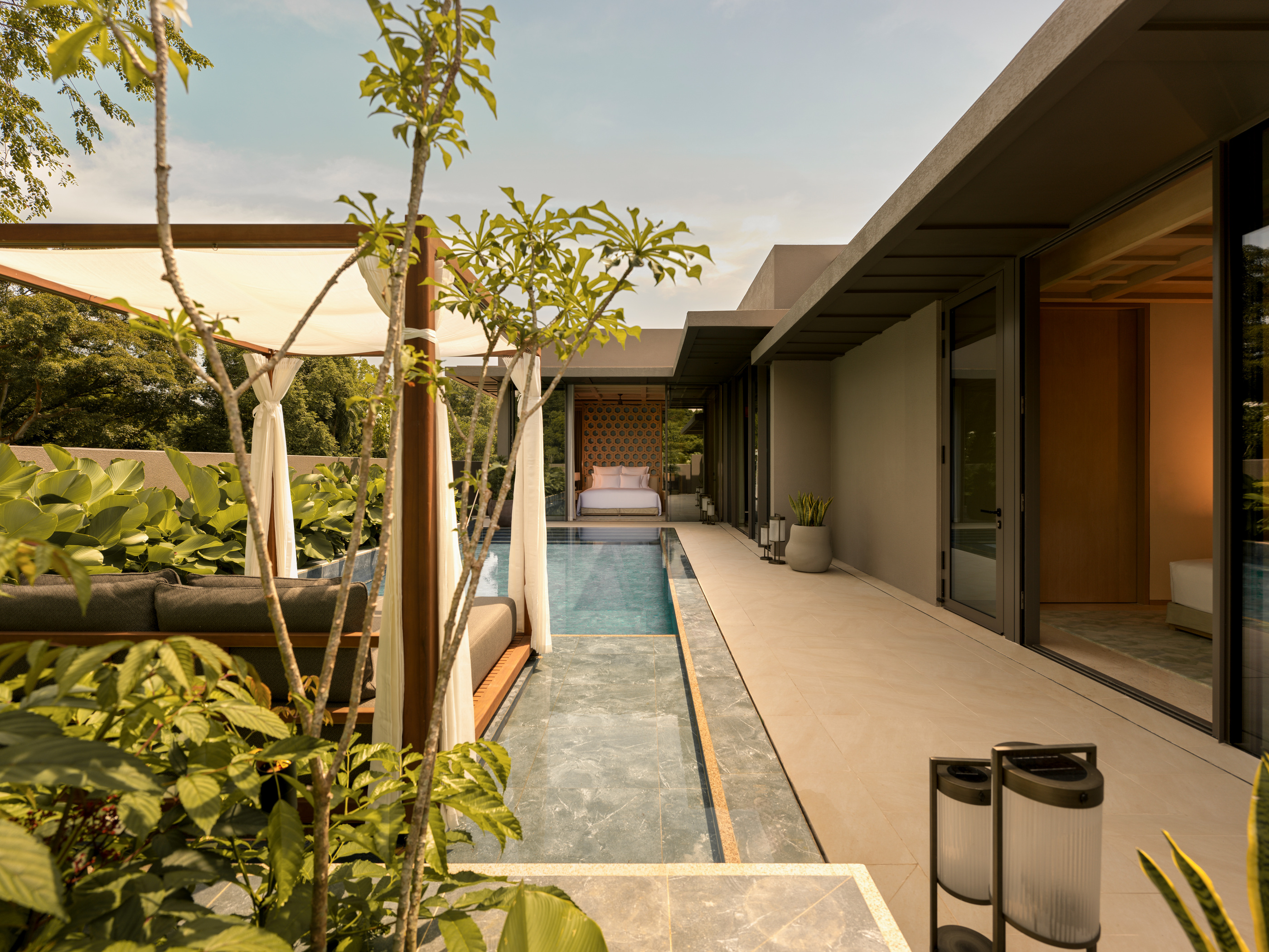 A pool and landscaped edge in the official villa presentation