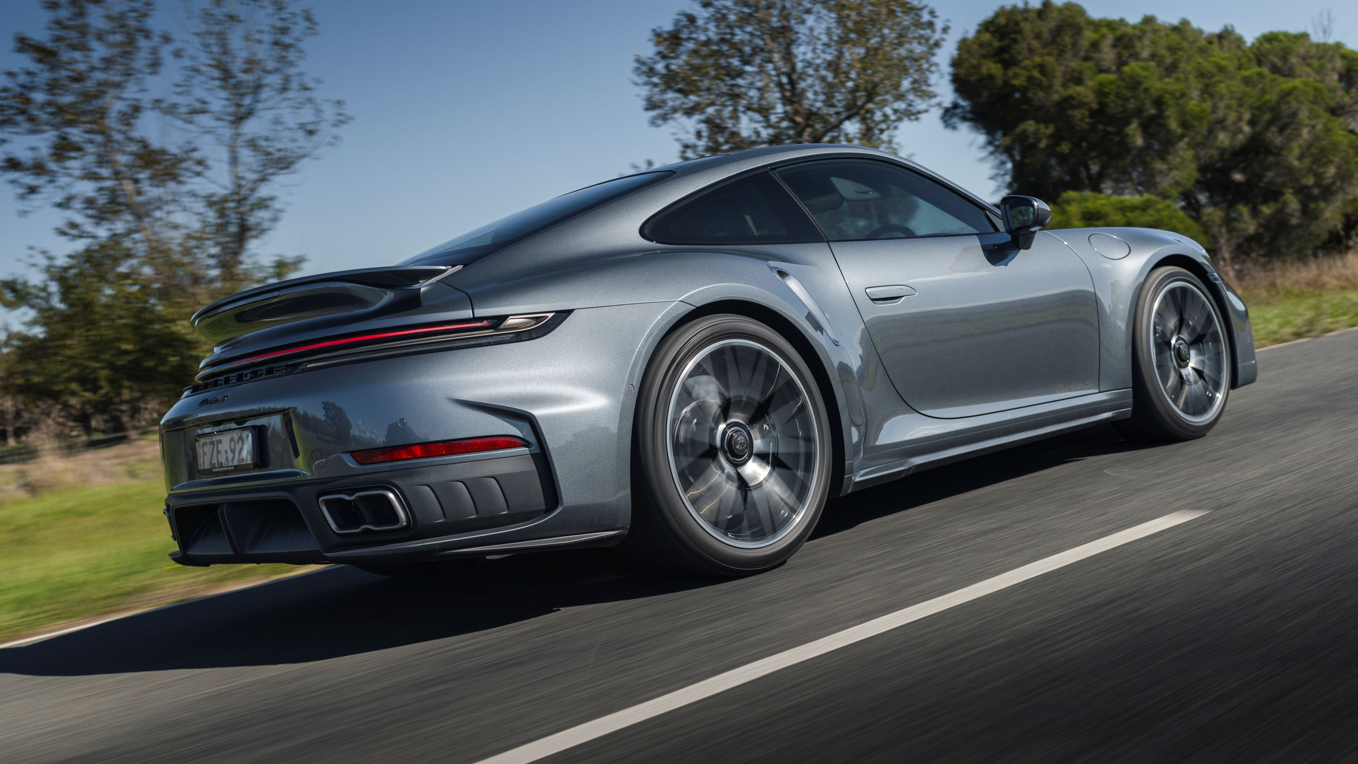 Grey Turbo S rear-quarter view in the official moving photograph