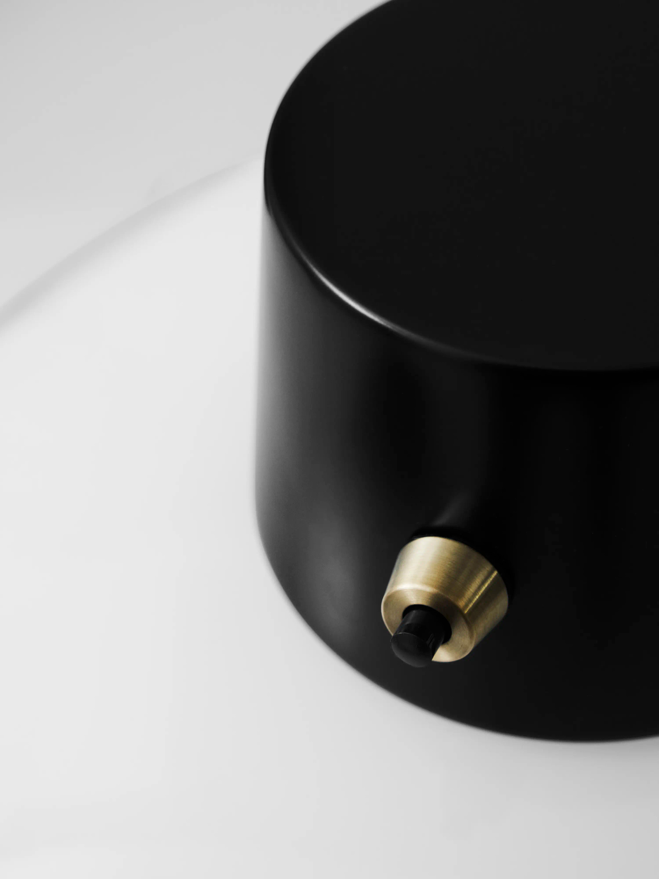 Dark shade surface and brass fitting in the official detail visual