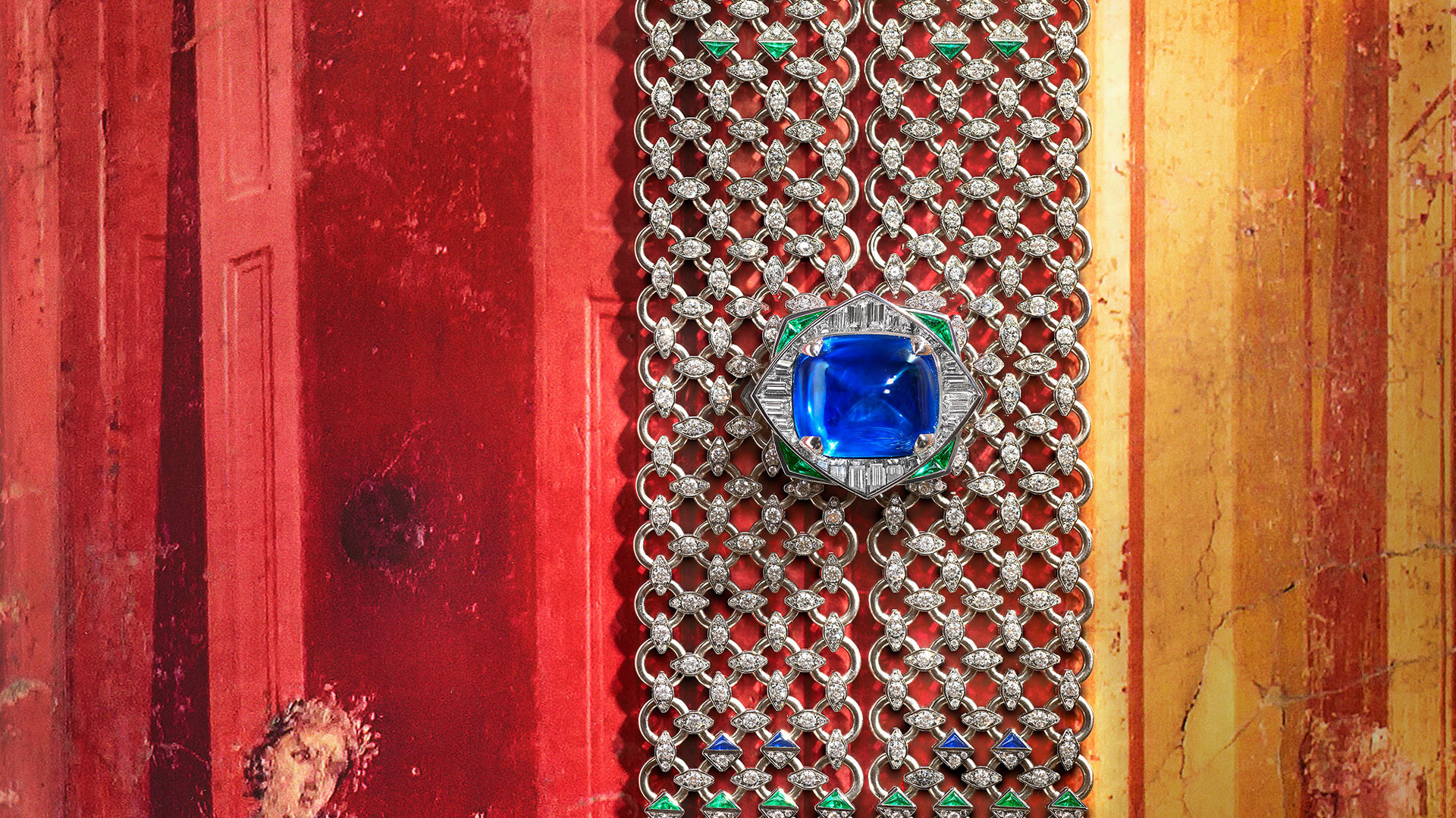 Seres Scarf and its central sapphire against a red display background