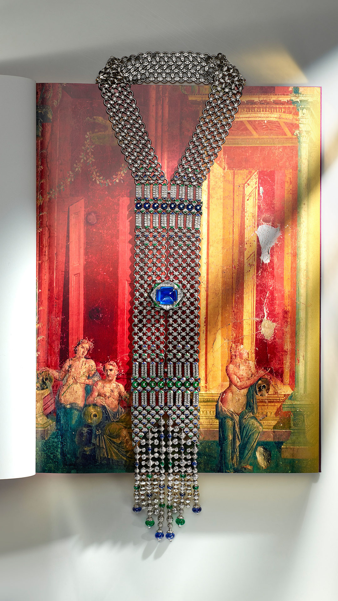 The central sapphire and surrounding linked elements in a vertical display view