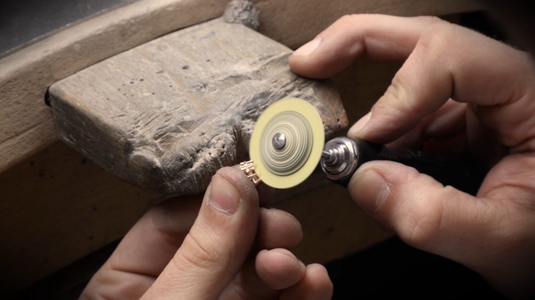 Fleurette: Seven Diamonds and the Space Around a Flower: Polishing a Fleurette jewel at the workshop bench Official illustration; not a private object or commissioned examination.