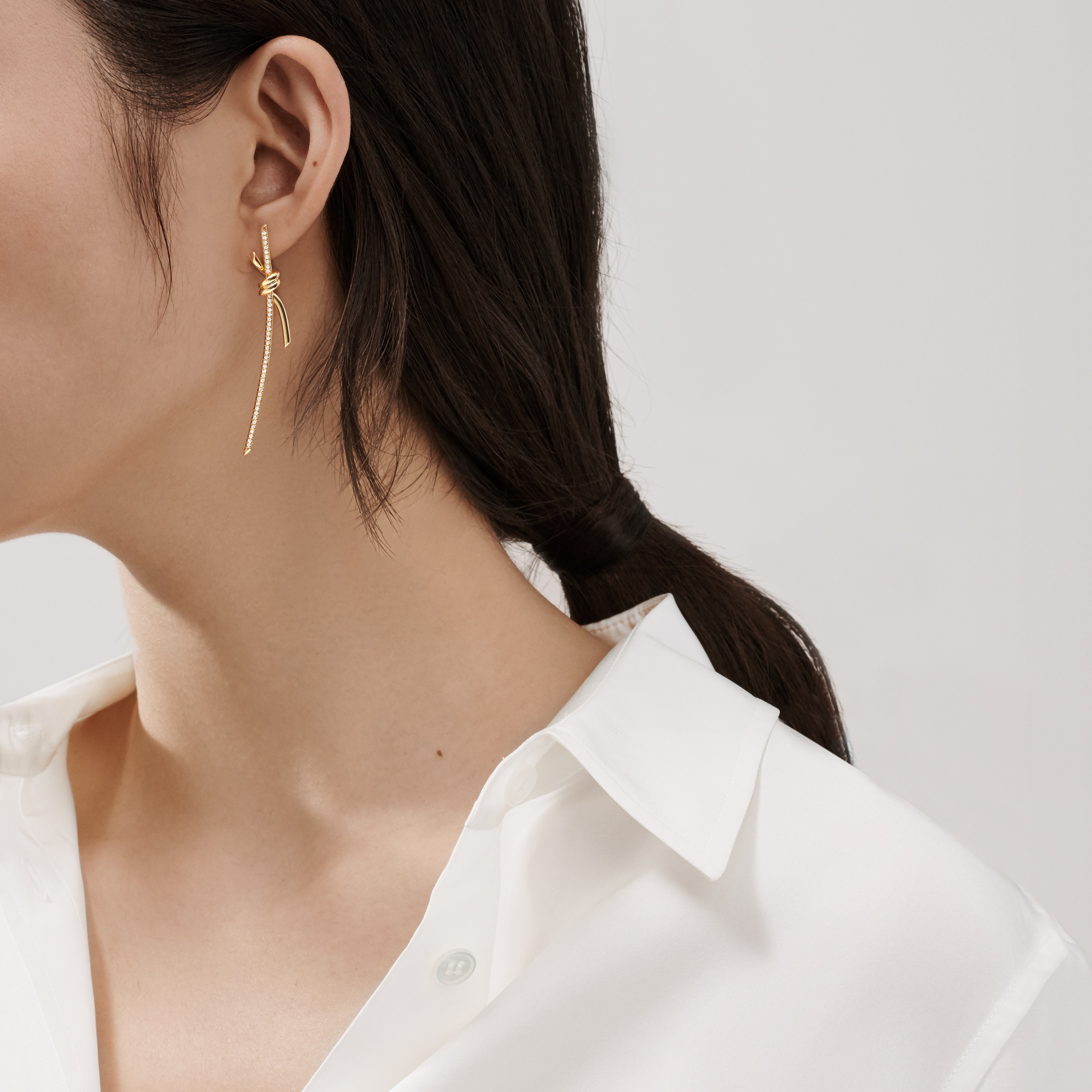 Tiffany Knot earrings worn against the face