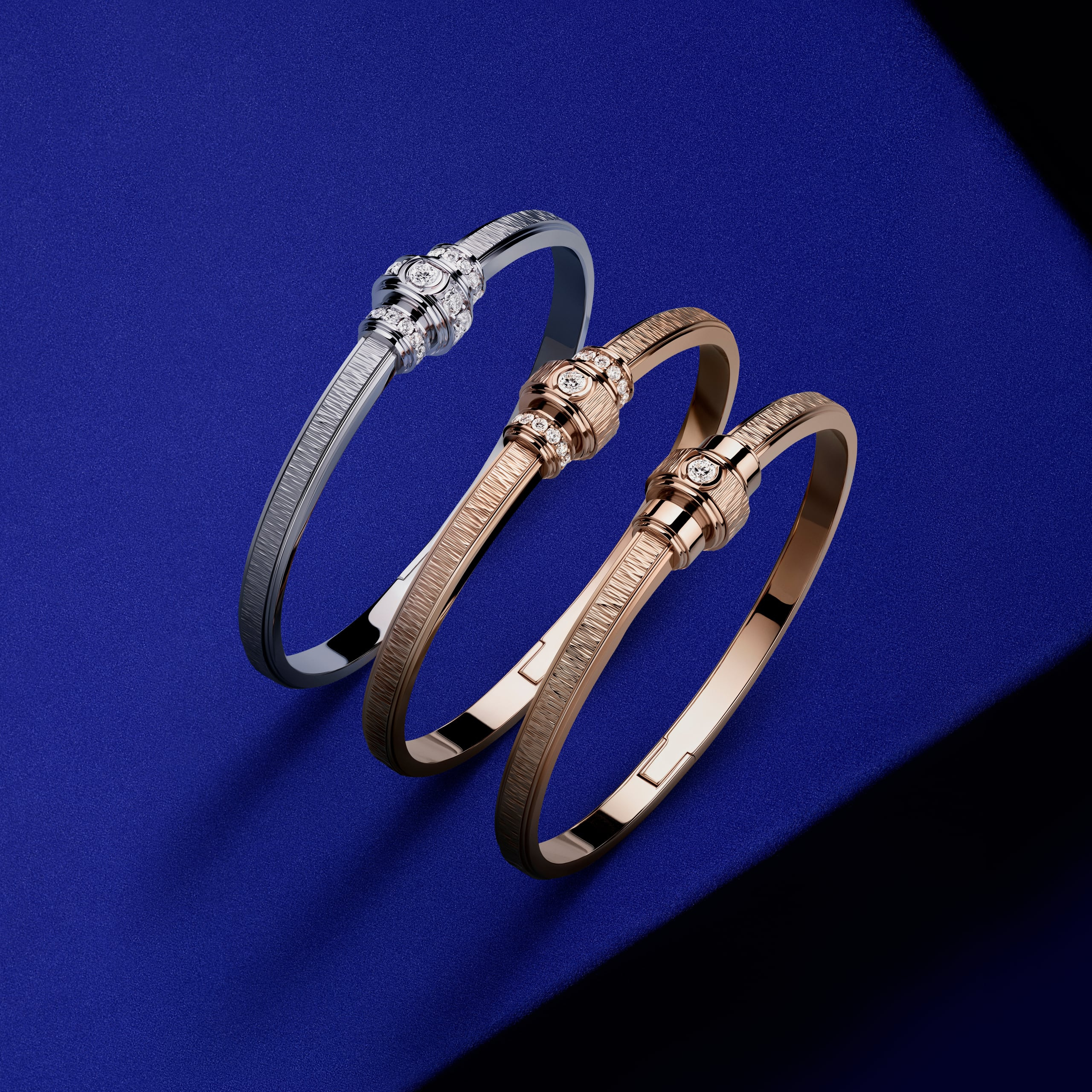 Piaget Possession: A Ring Designed Around a Turning Band: Three Possession bracelets against a blue display field Official illustration; not a private object or commissioned examination.