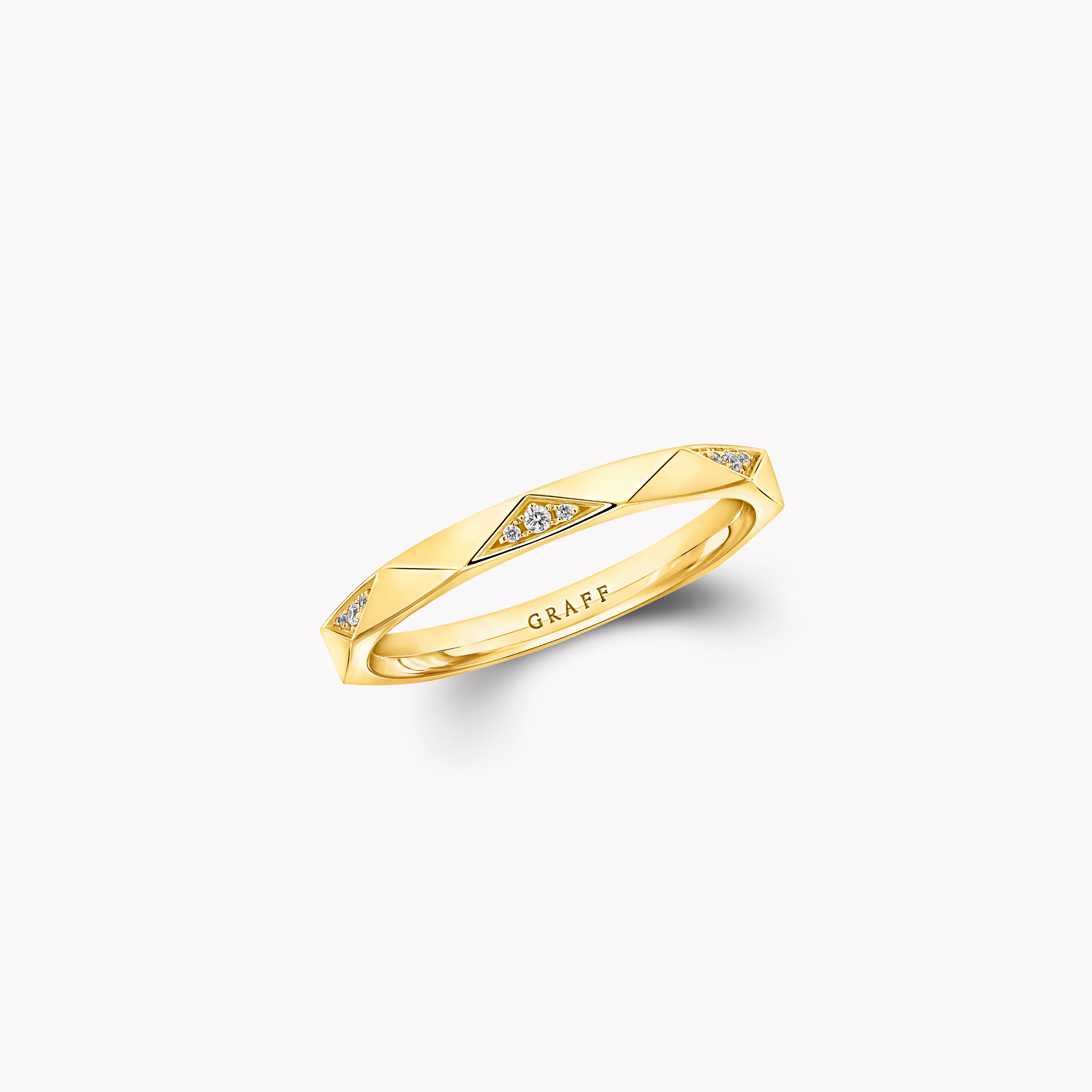 A faceted band ring photographed as a complete object
