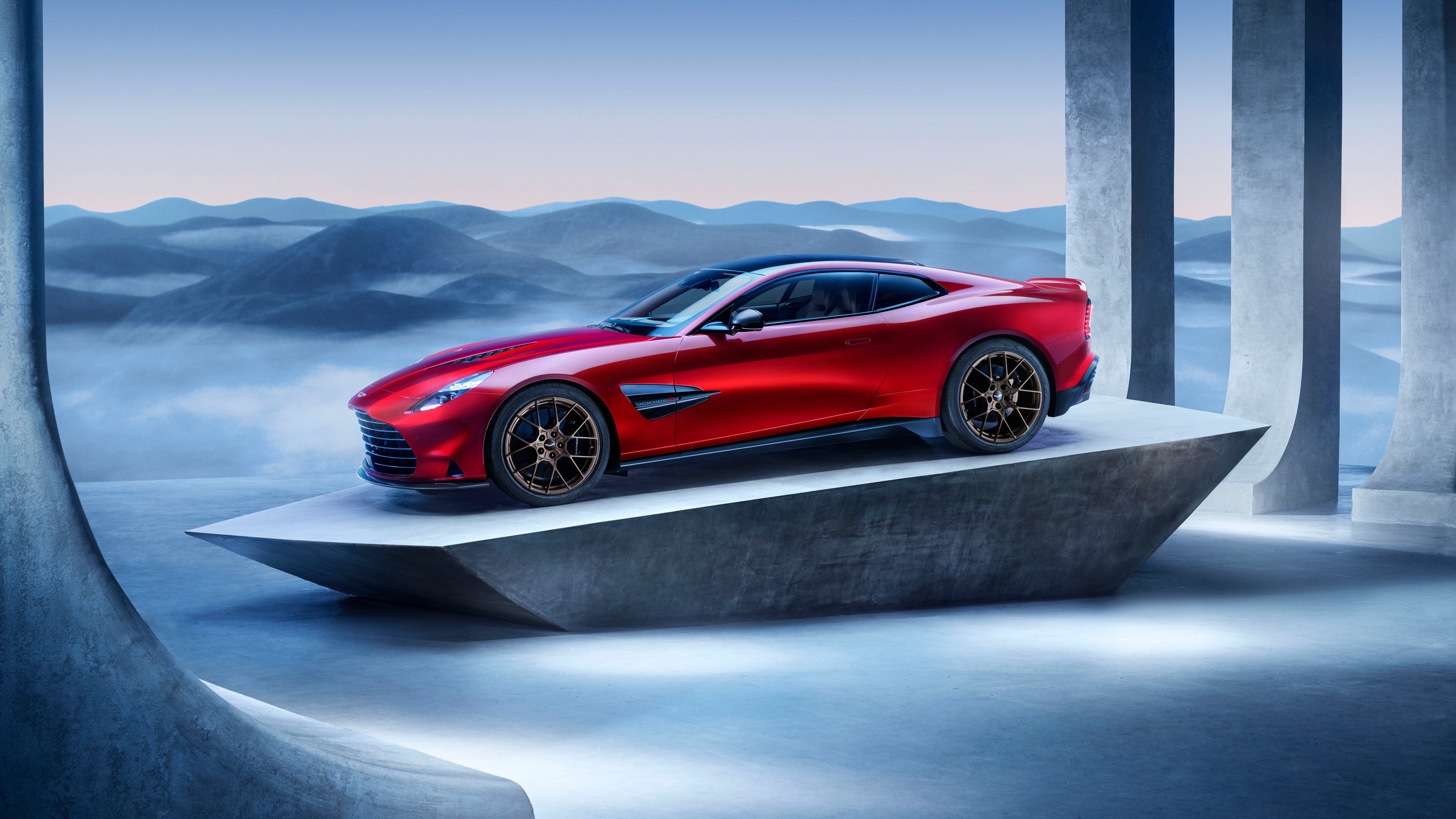 Vanquish in the official architectural launch visual, showing the long bonnet and rear-set cabin.