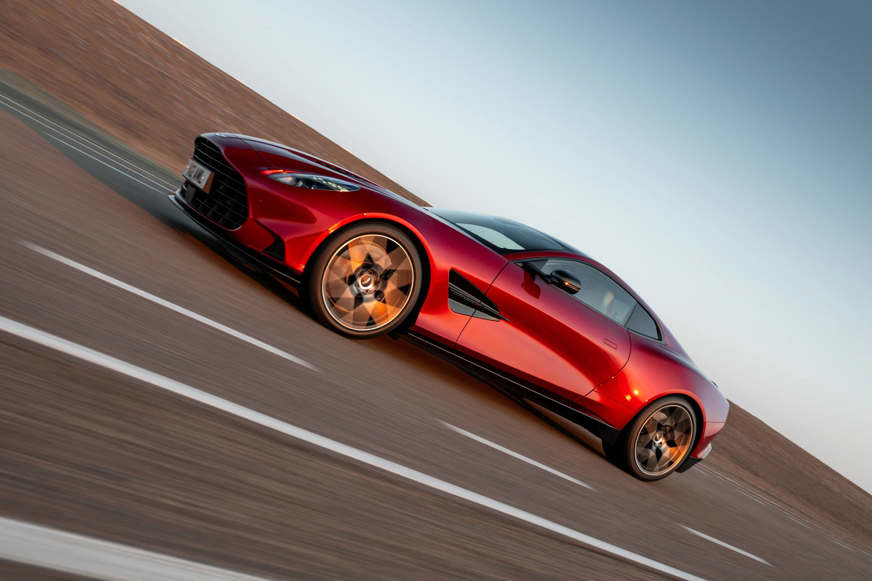 Vanquish photographed in motion in Aston Martin’s official road sequence.