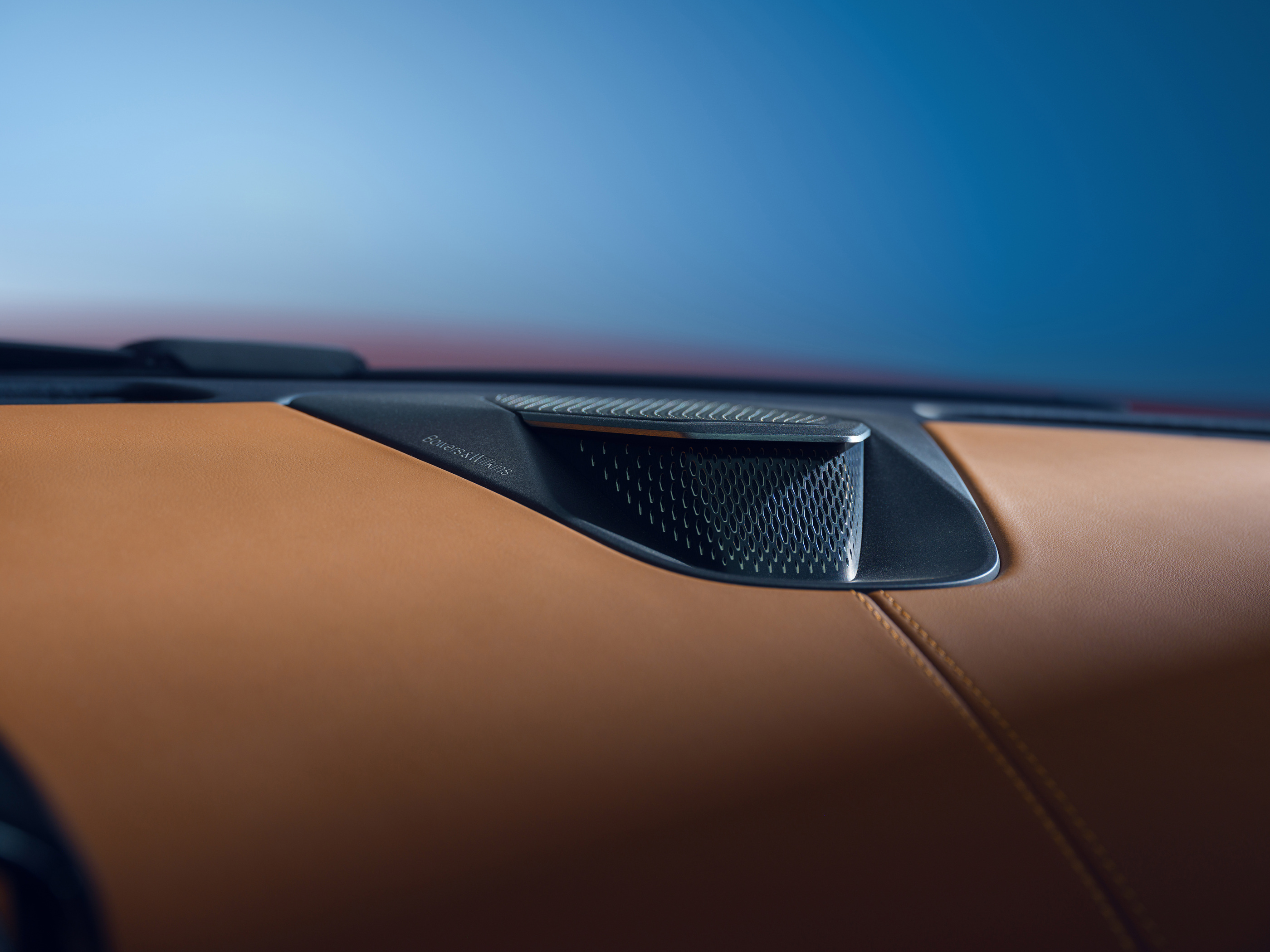 Speaker and leather detail in the official Vanquish cabin imagery.