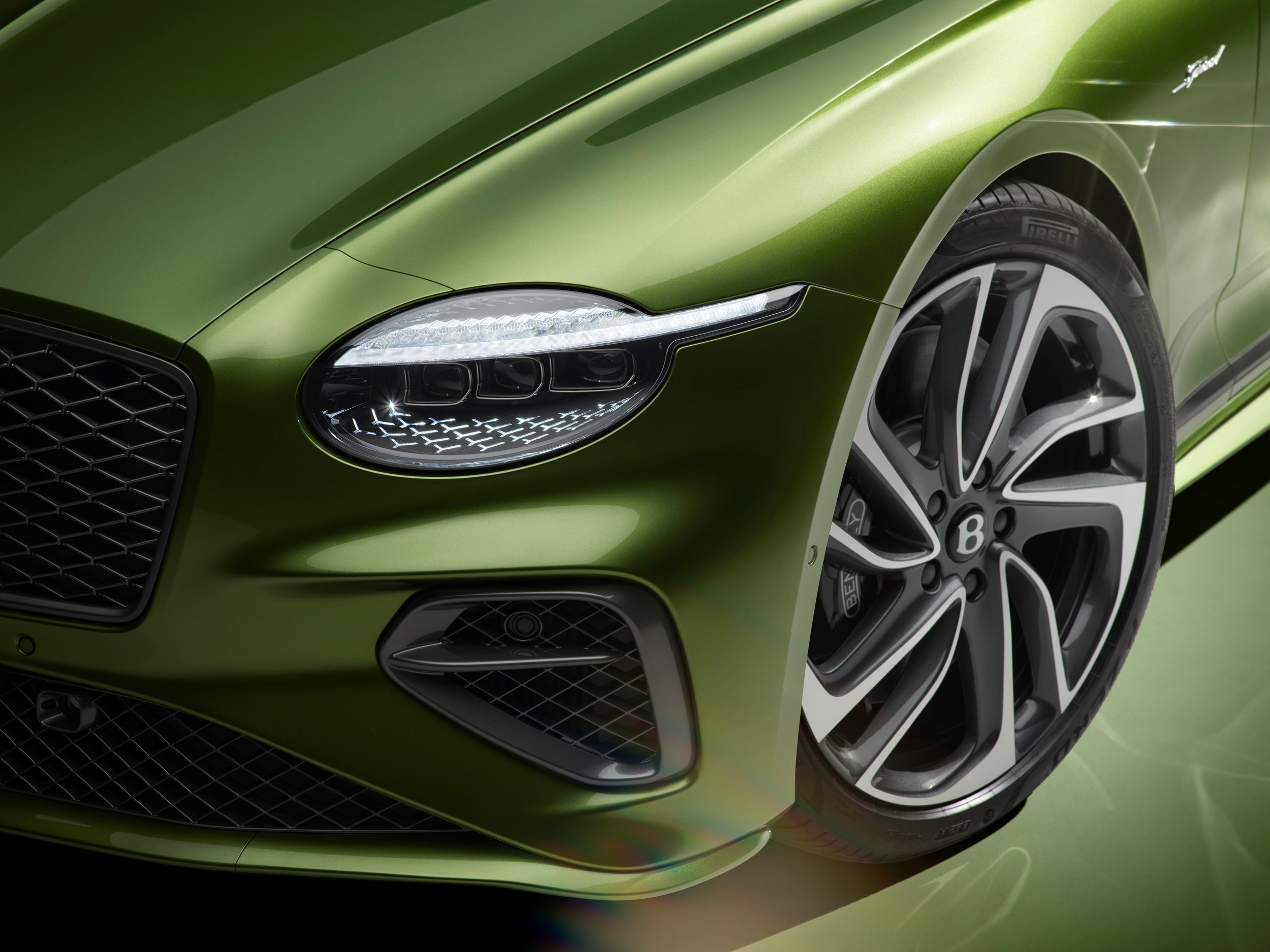 Single headlamp and front-wheel detail on the fourth-generation GT Speed.
