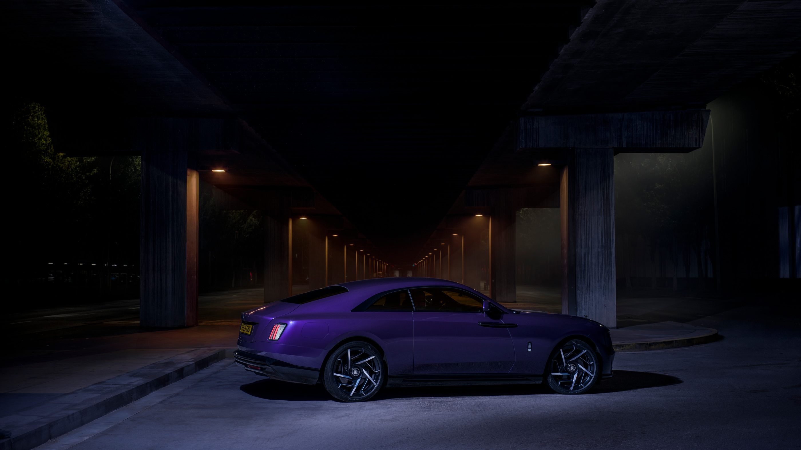 Side-on night view of the 2025 Black Badge Spectre.