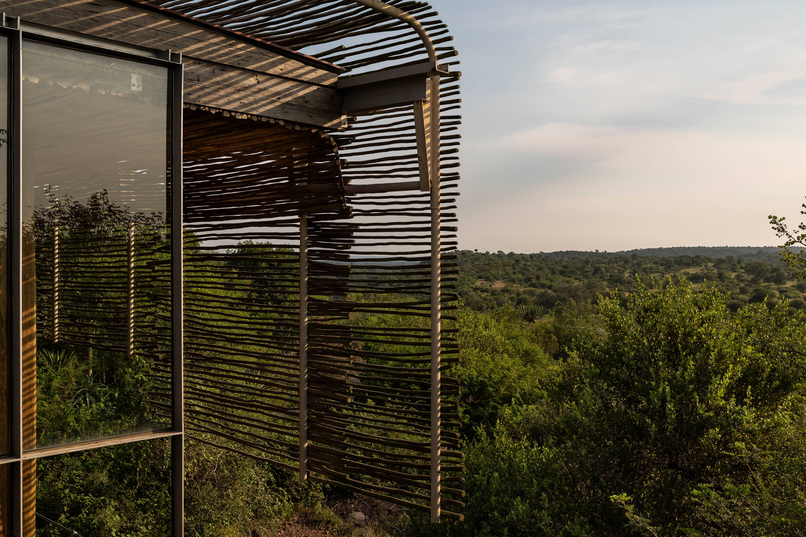 Shading elements and the landscape beyond a Lebombo interior.