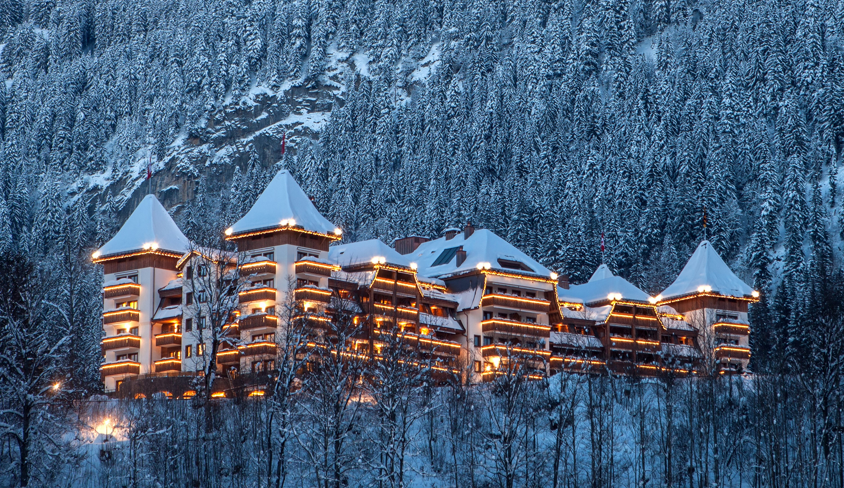 The Alpina Gstaad exterior in the property’s official winter imagery.
