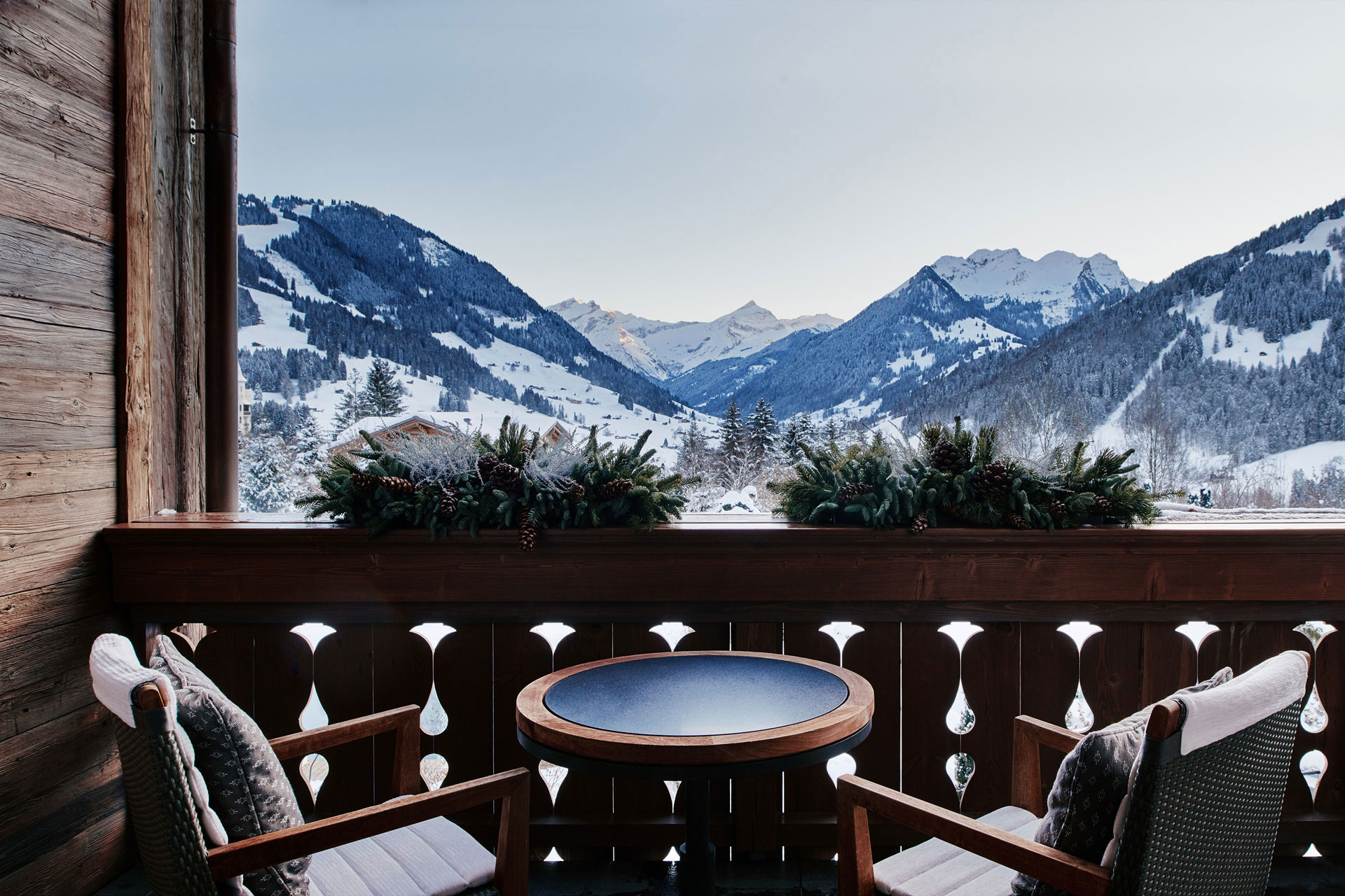 Private terrace and mountain view in the official accommodation sequence.