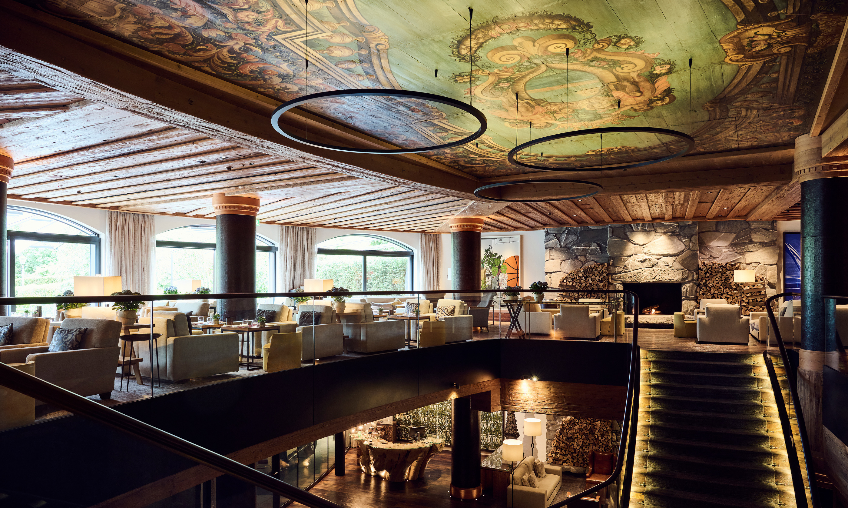 The Alpina Gstaad bar and decorated ceiling.