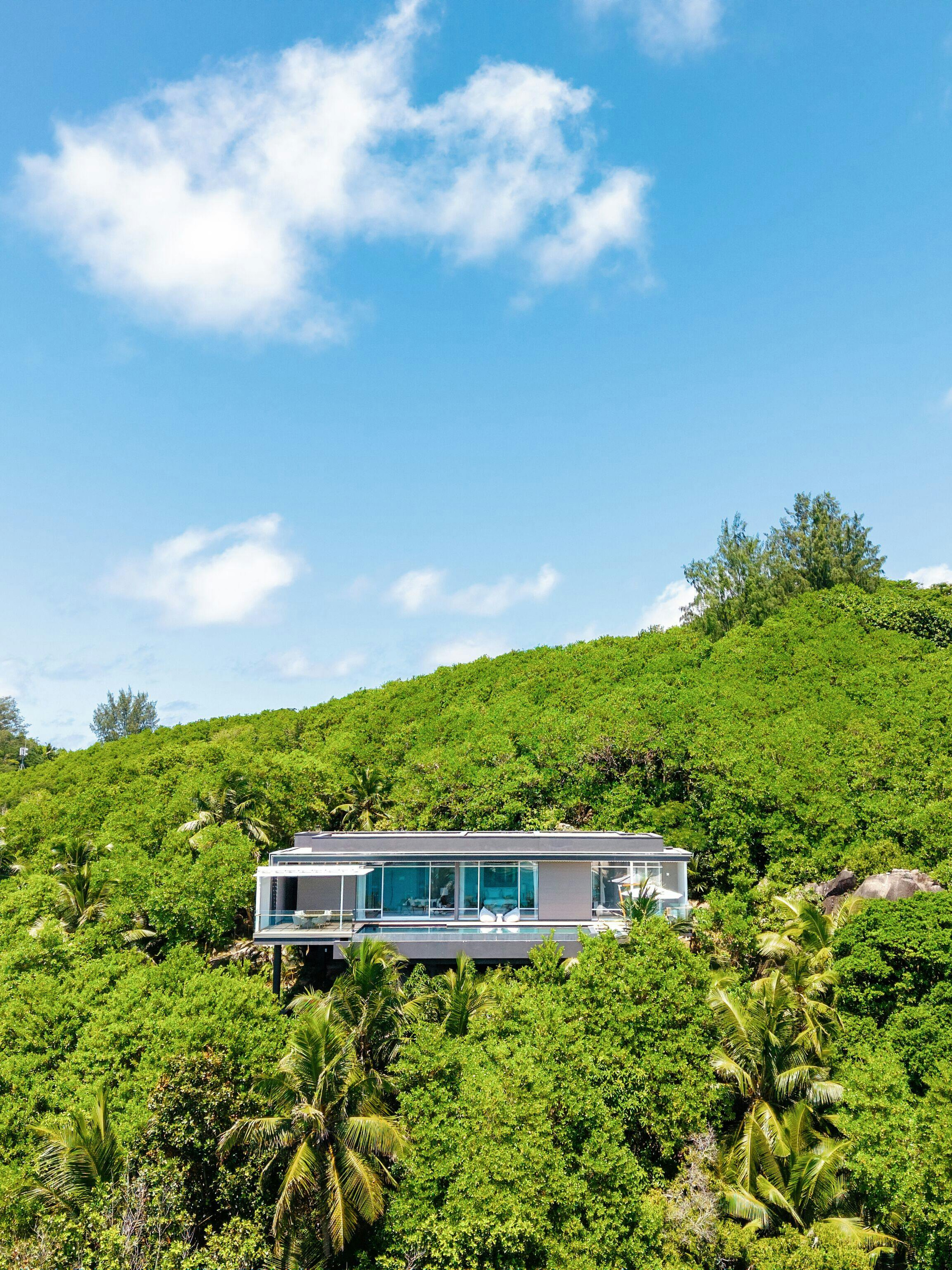 A hillside villa above the vegetation, as shown in official property imagery.