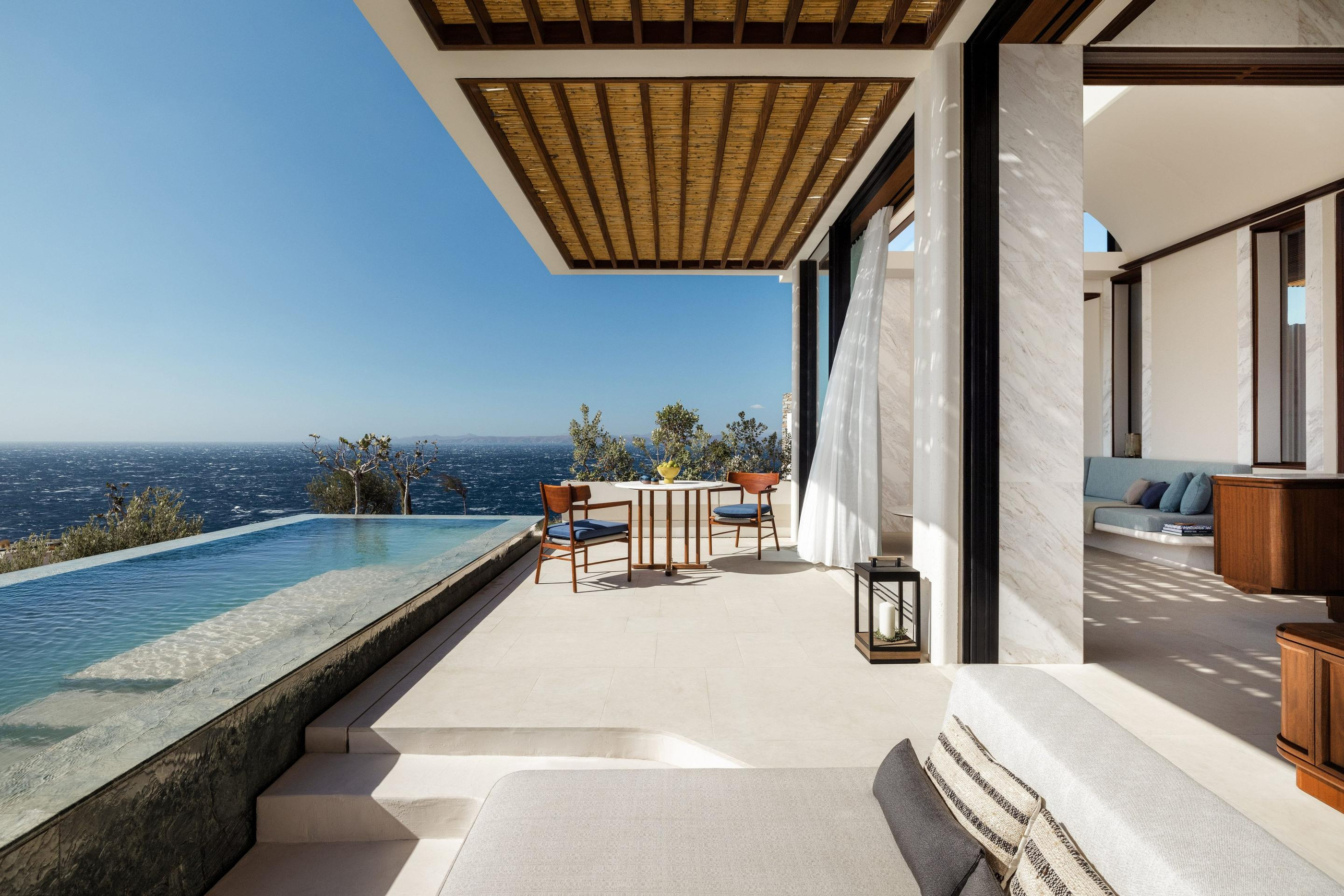 Shaded villa terrace beside a private pool.