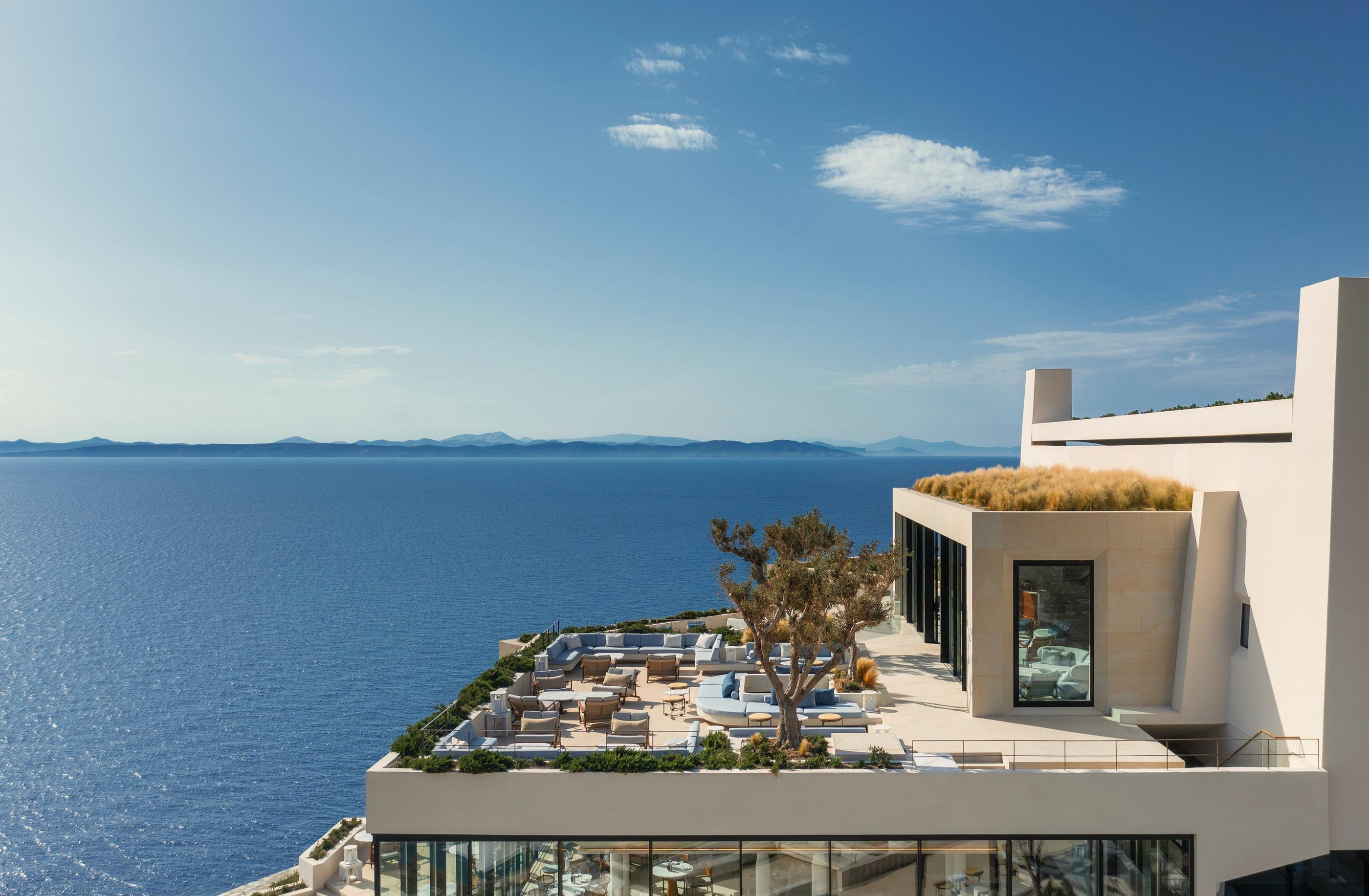 Resort villas following the Kéa hillside towards the sea.