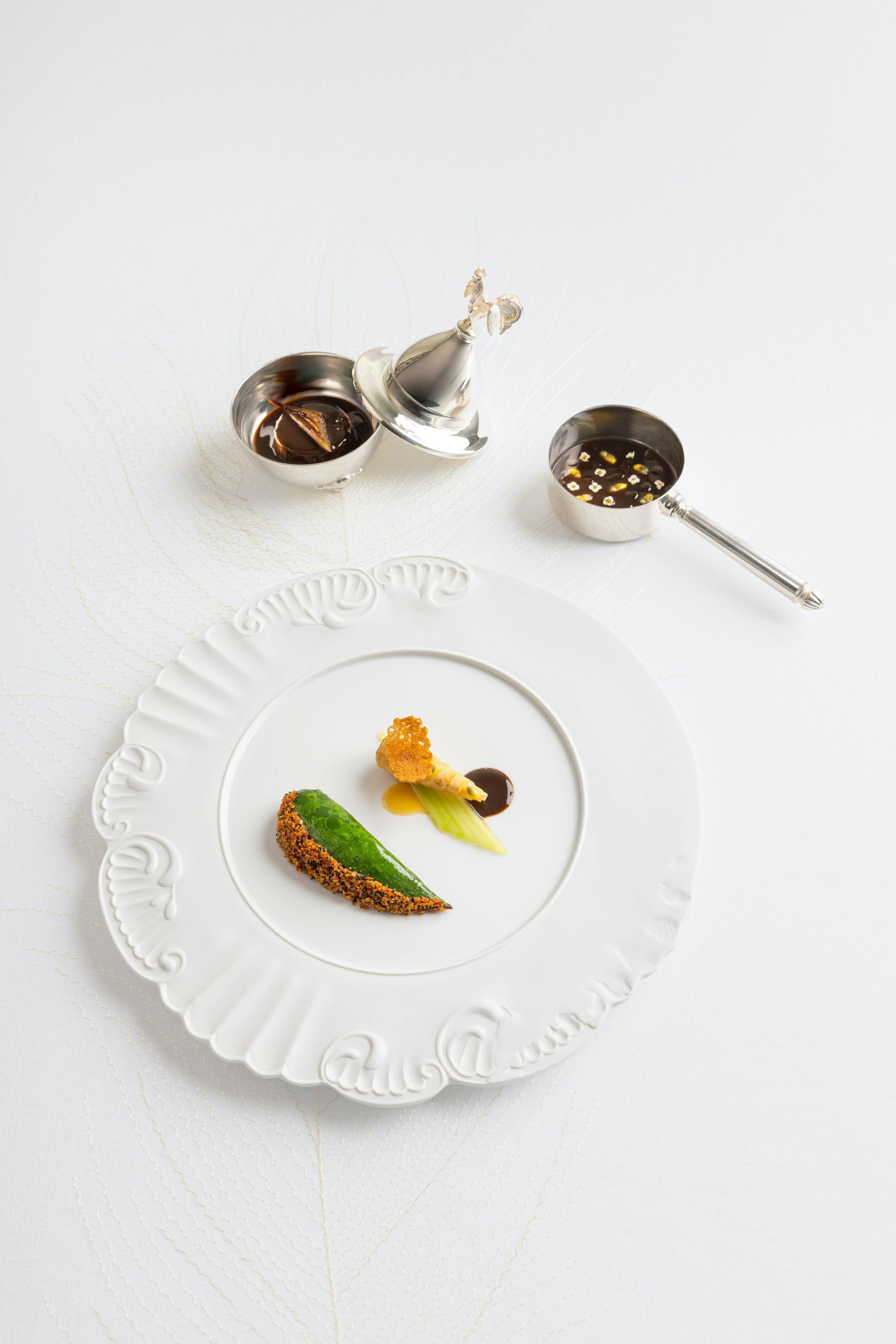 An official Plénitude composition with sauces presented beside the plate.
