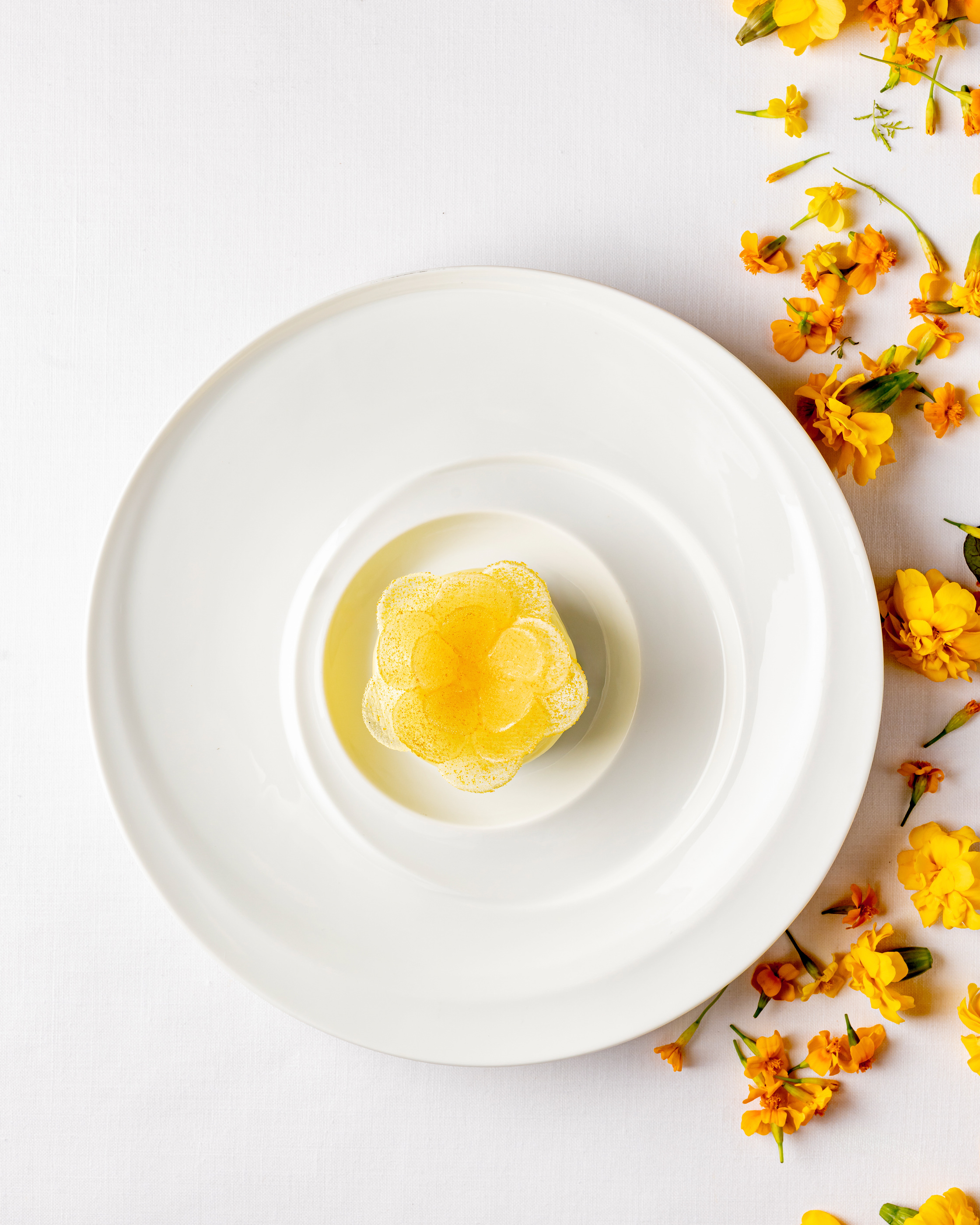 A dessert composition with floral elements from the restaurant’s official imagery.