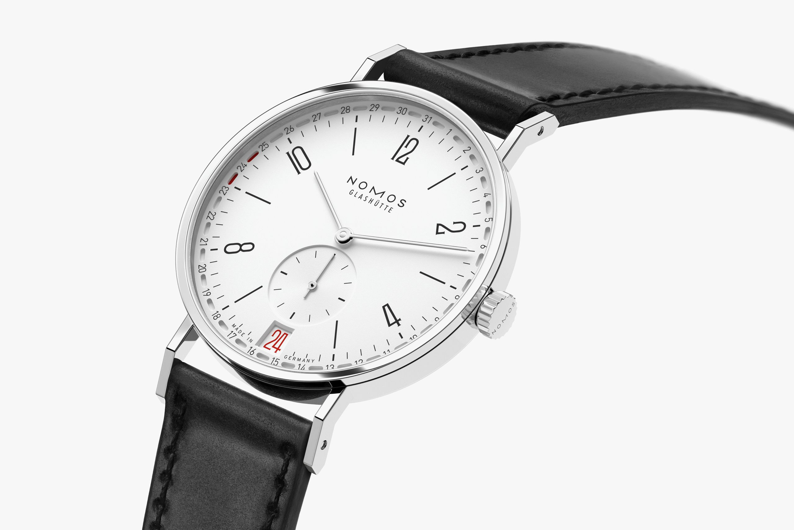 Tangente 2date reference 135, with white silver-plated dial and black leather strap.