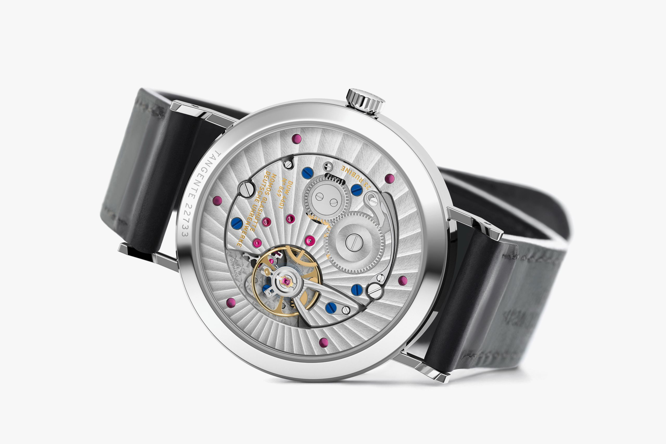 Tangente 2date and the hand-wound movement visible through its sapphire back.
