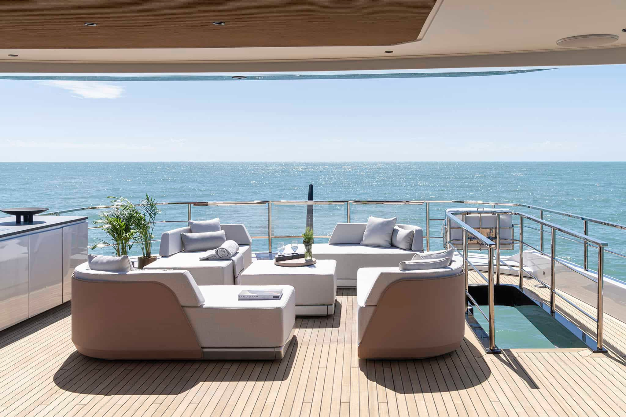 A sheltered upper-deck setting connected to the Grande 36M interior.