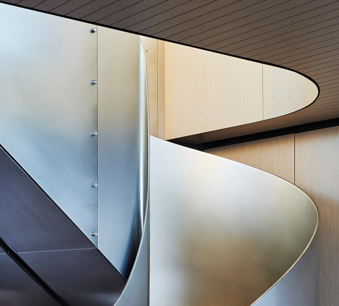 A curved staircase detail from the official SX100 interior presentation.